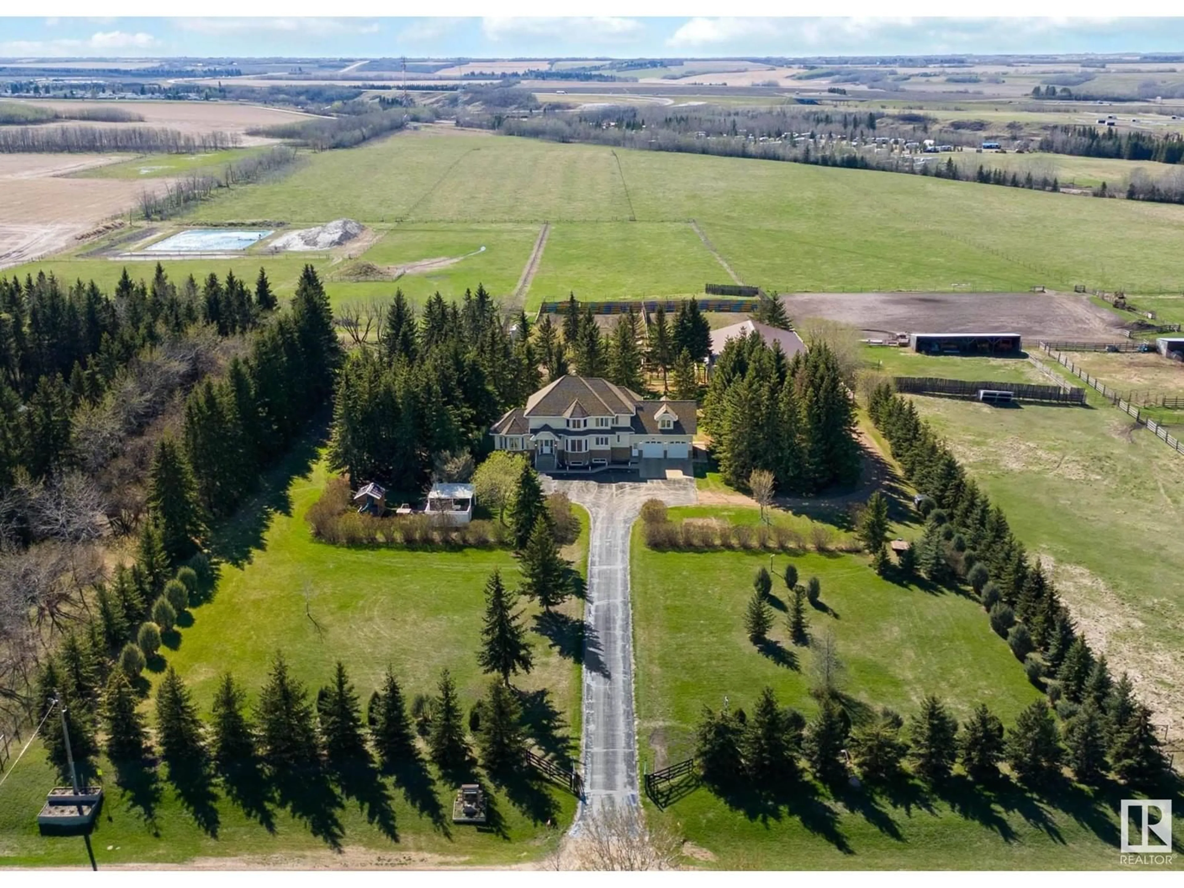 A pic from outside/outdoor area/front of a property/back of a property/a pic from drone, mountain view for 56220 Rge Rd 231, Rural Sturgeon County Alberta T0A1N4