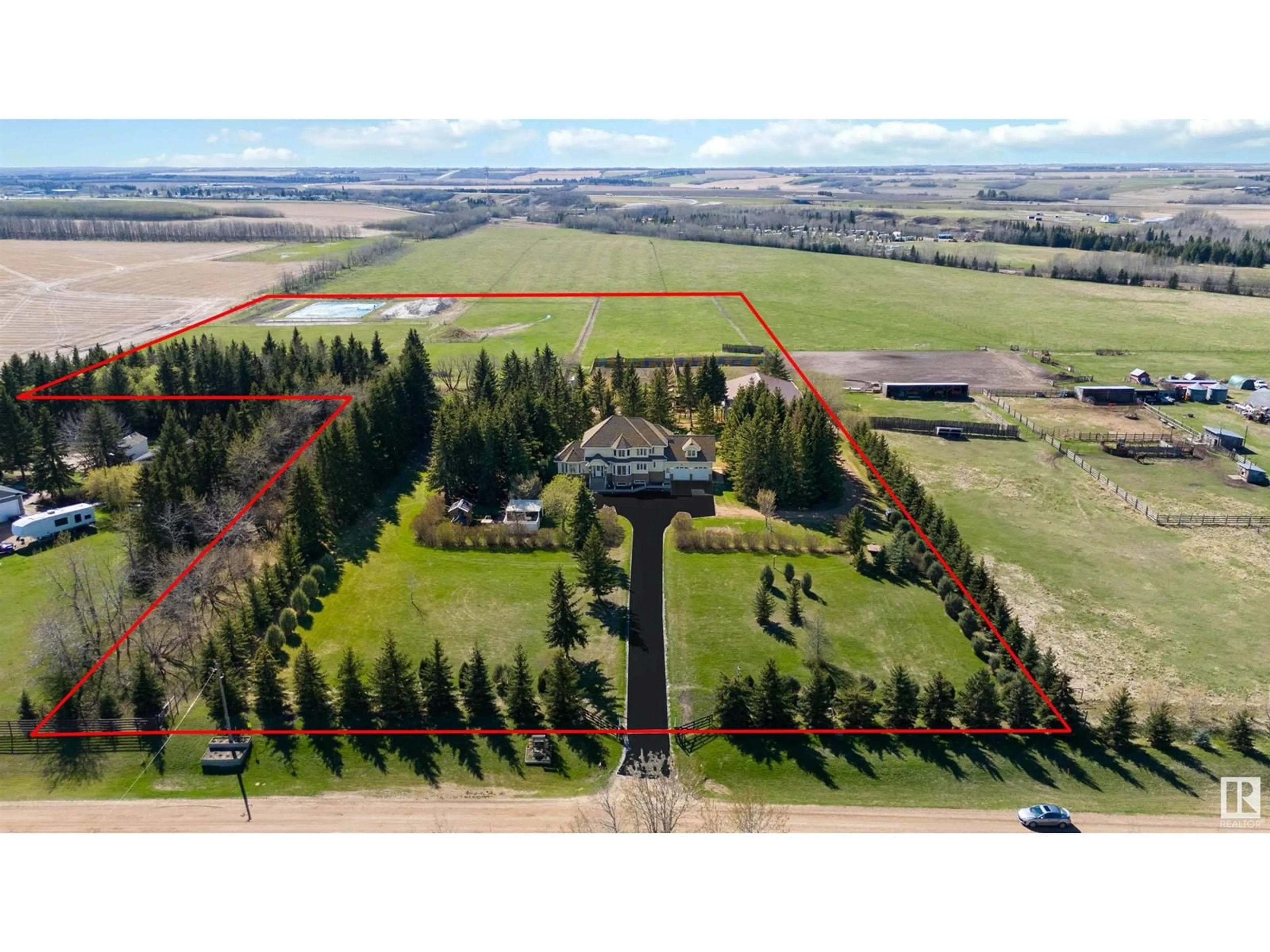 A pic from outside/outdoor area/front of a property/back of a property/a pic from drone, unknown for 56220 Rge Rd 231, Rural Sturgeon County Alberta T0A1N4