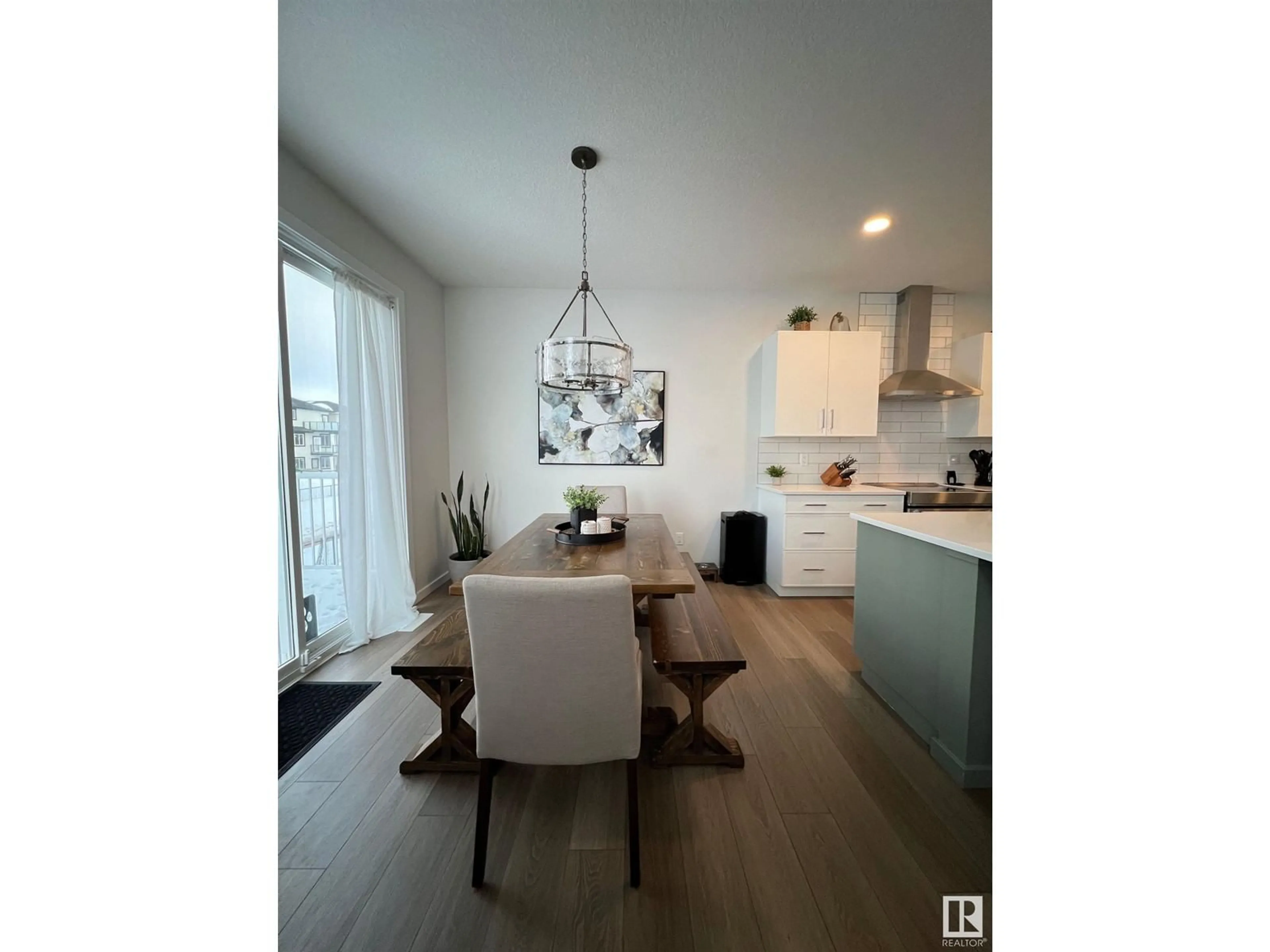 Open concept kitchen, wood/laminate floor for 147 Stiles BN, Leduc Alberta T9E1N8