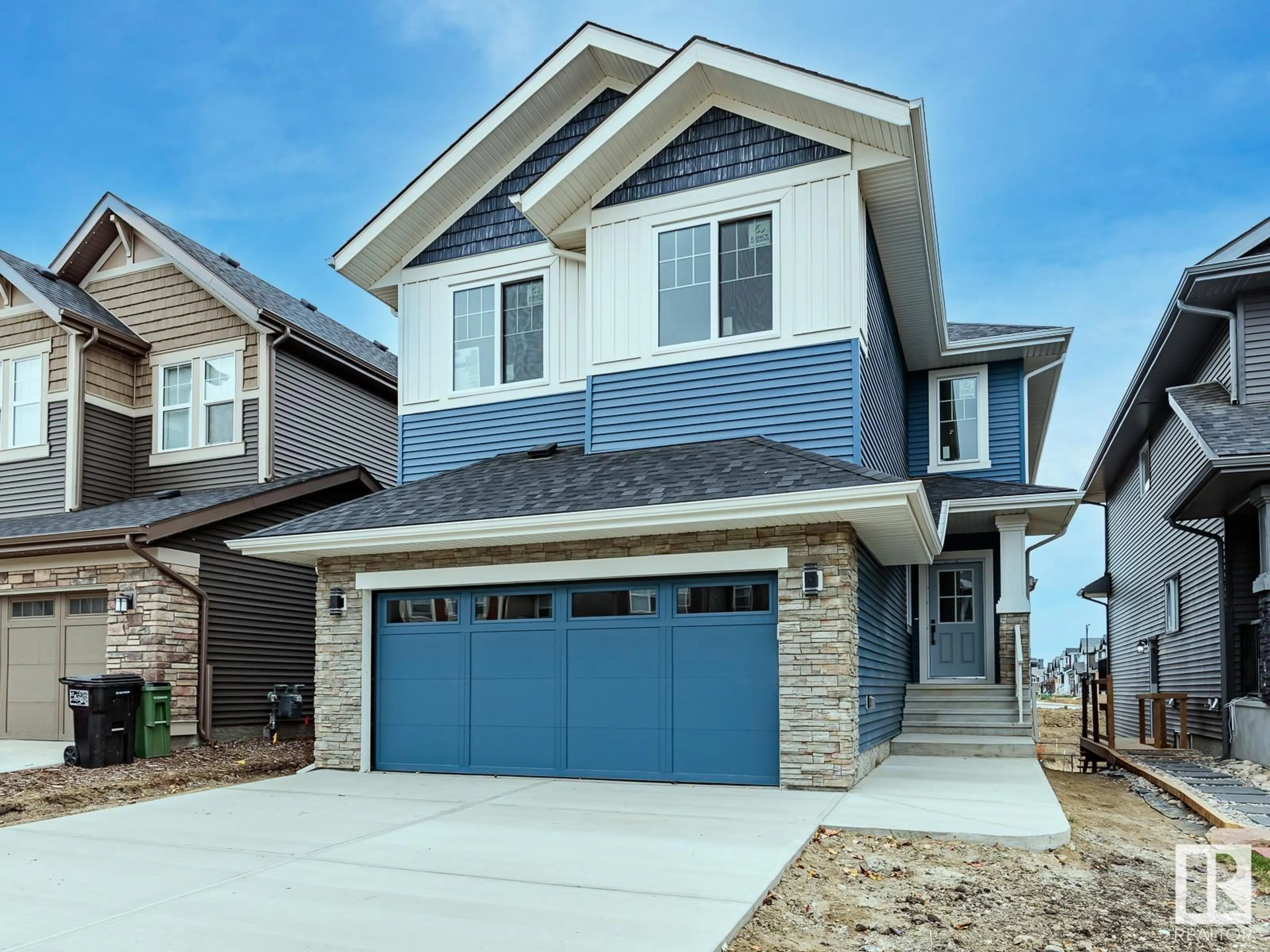 Home with vinyl exterior material, street for 516 MERLIN LANDING LD NW, Edmonton Alberta T5S0L9