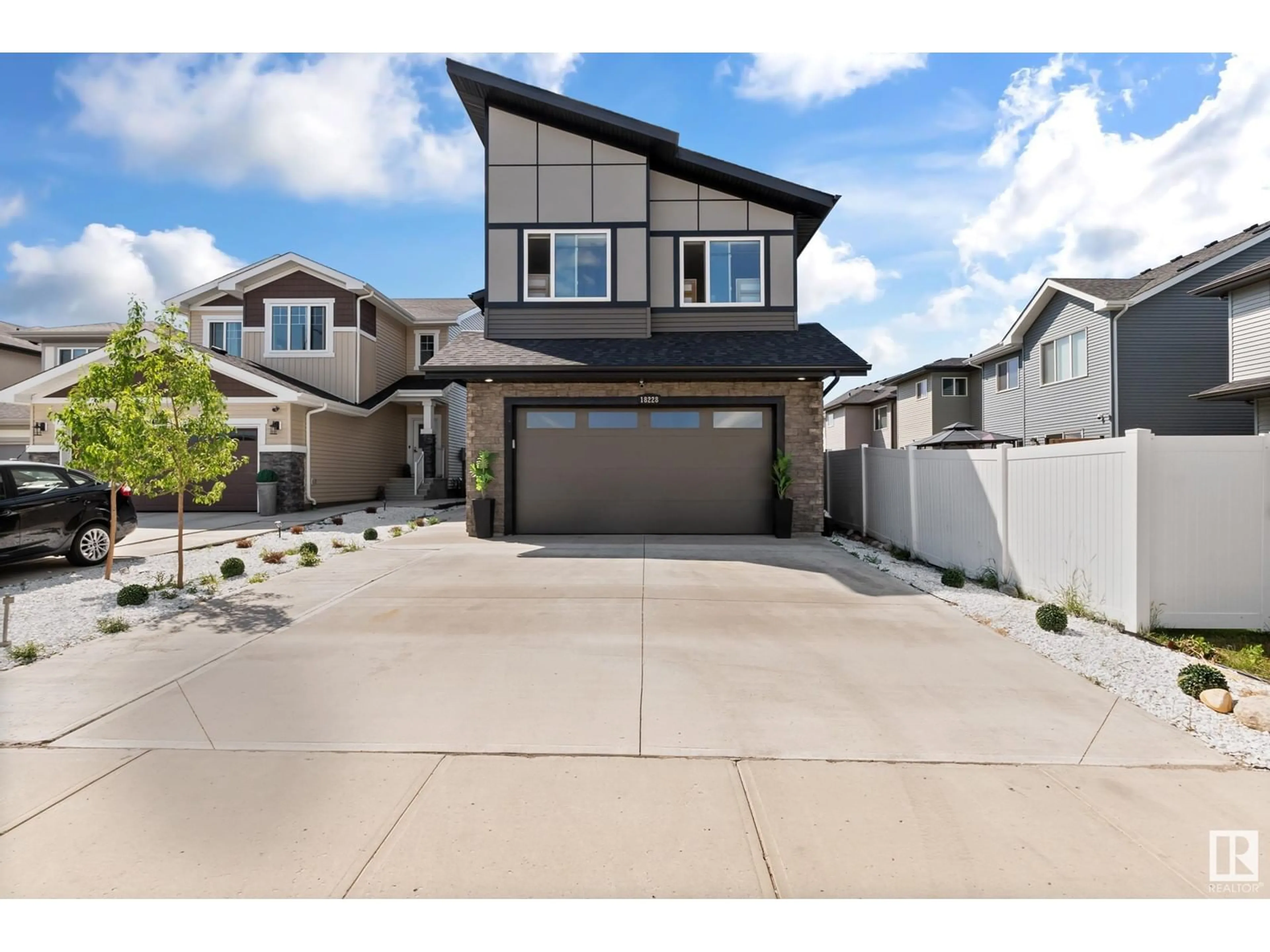 Home with vinyl exterior material, street for 18228 90 ST NW, Edmonton Alberta T5Z0S7