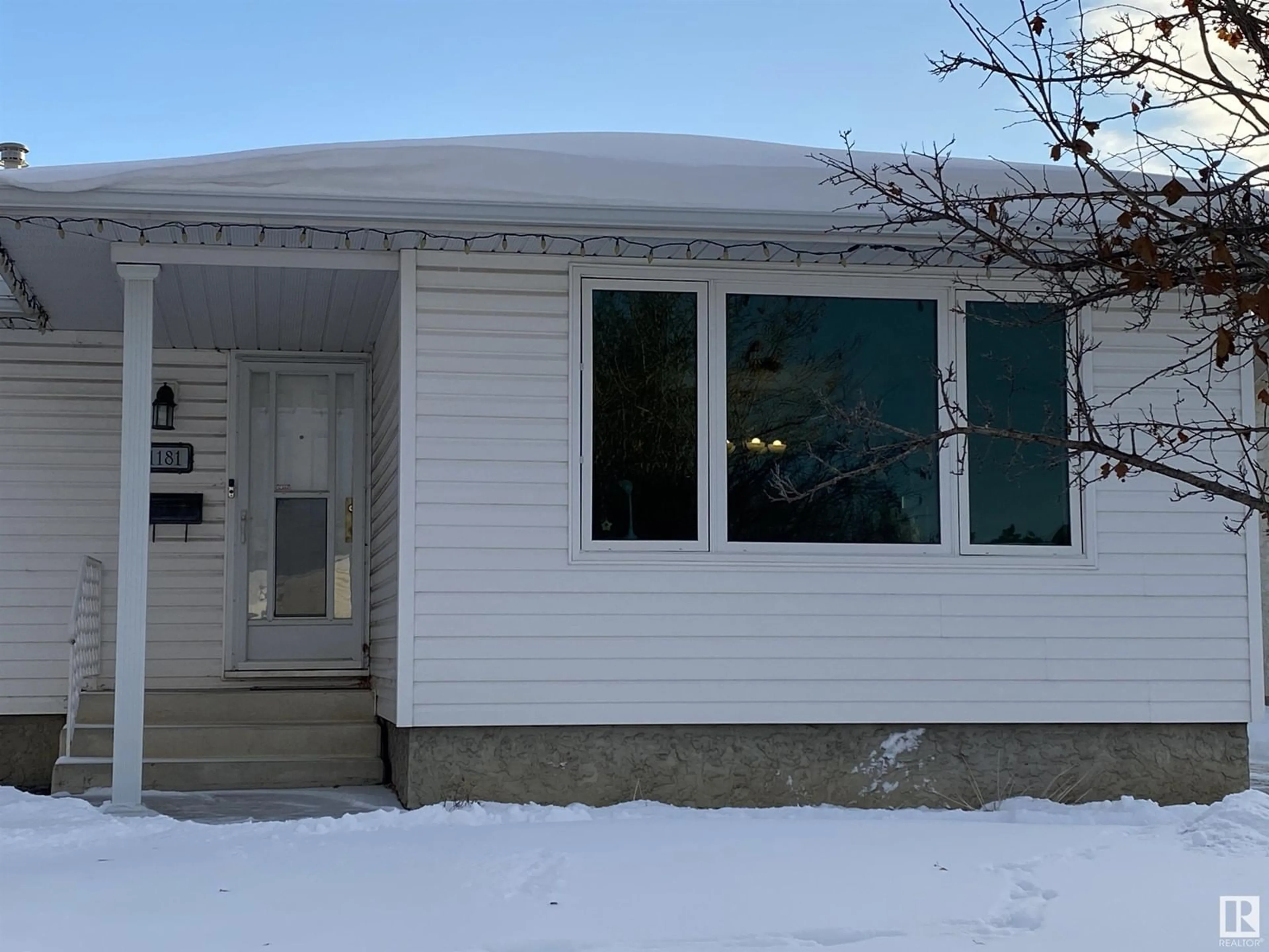 Home with vinyl exterior material, street for 1181 68 Street NW NW, Edmonton Alberta T6K3K4