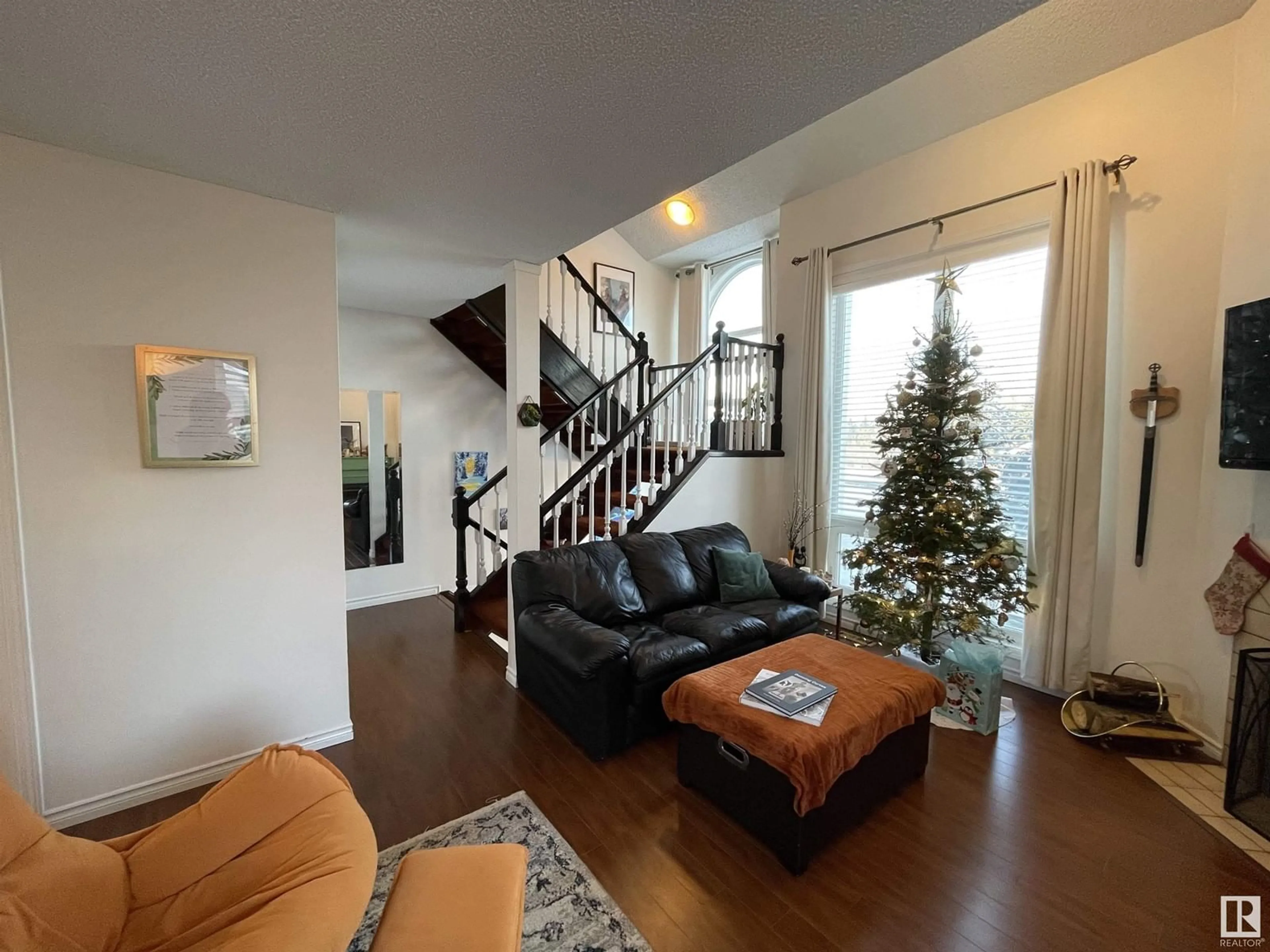 Living room with furniture, wood/laminate floor for #30 1440 Sherwood DR, Sherwood Park Alberta T8A4W3