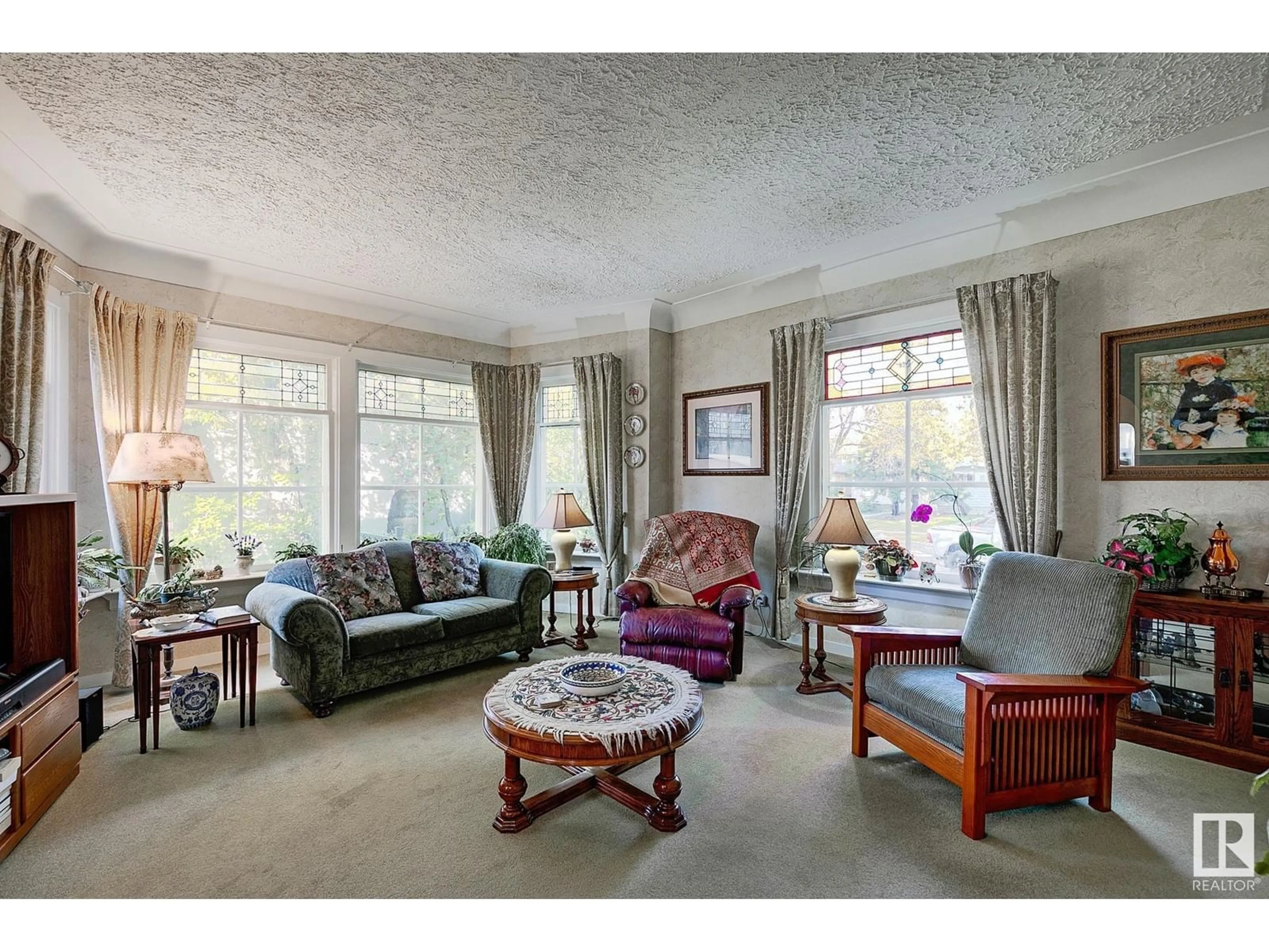 Living room with furniture, carpet floor for 13311 124 AV NW, Edmonton Alberta T5L3A4