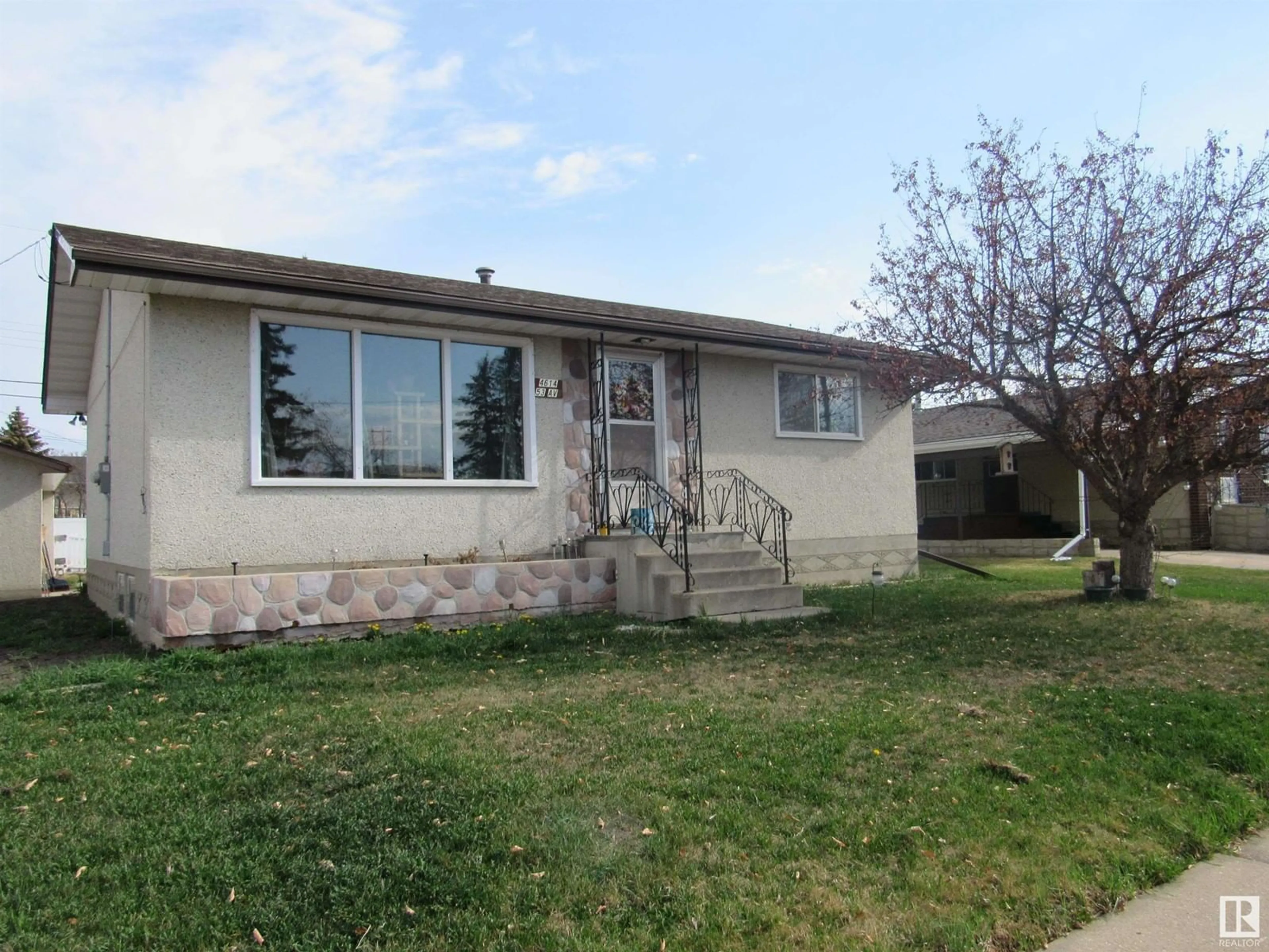 Home with vinyl exterior material, street for 4614 53 Avenue, Barrhead Alberta T7N1K8