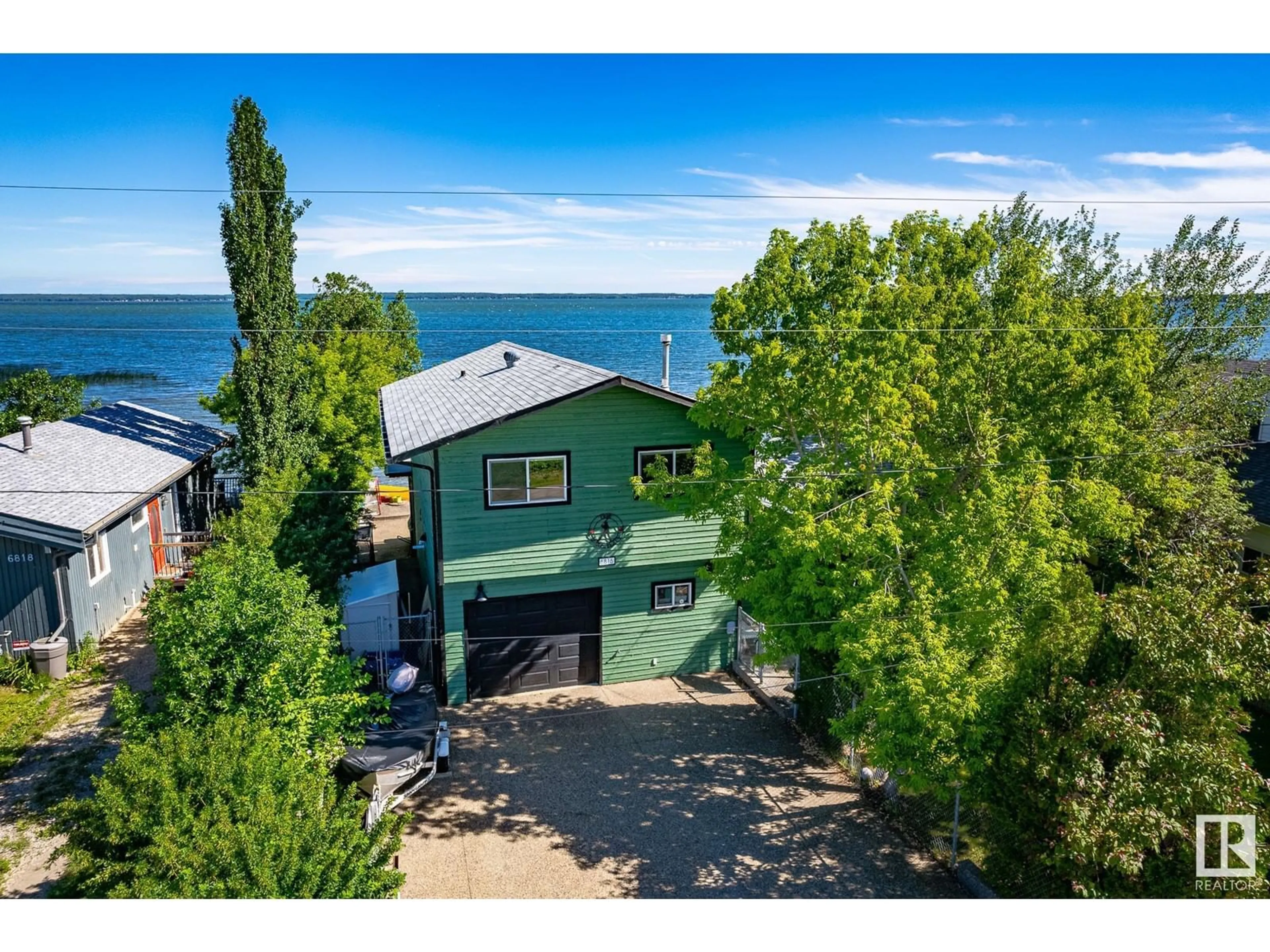 A pic from outside/outdoor area/front of a property/back of a property/a pic from drone, water/lake/river/ocean view for 6816 ST.ANNE TRAIL, Rural Lac Ste. Anne County Alberta T0E0A0