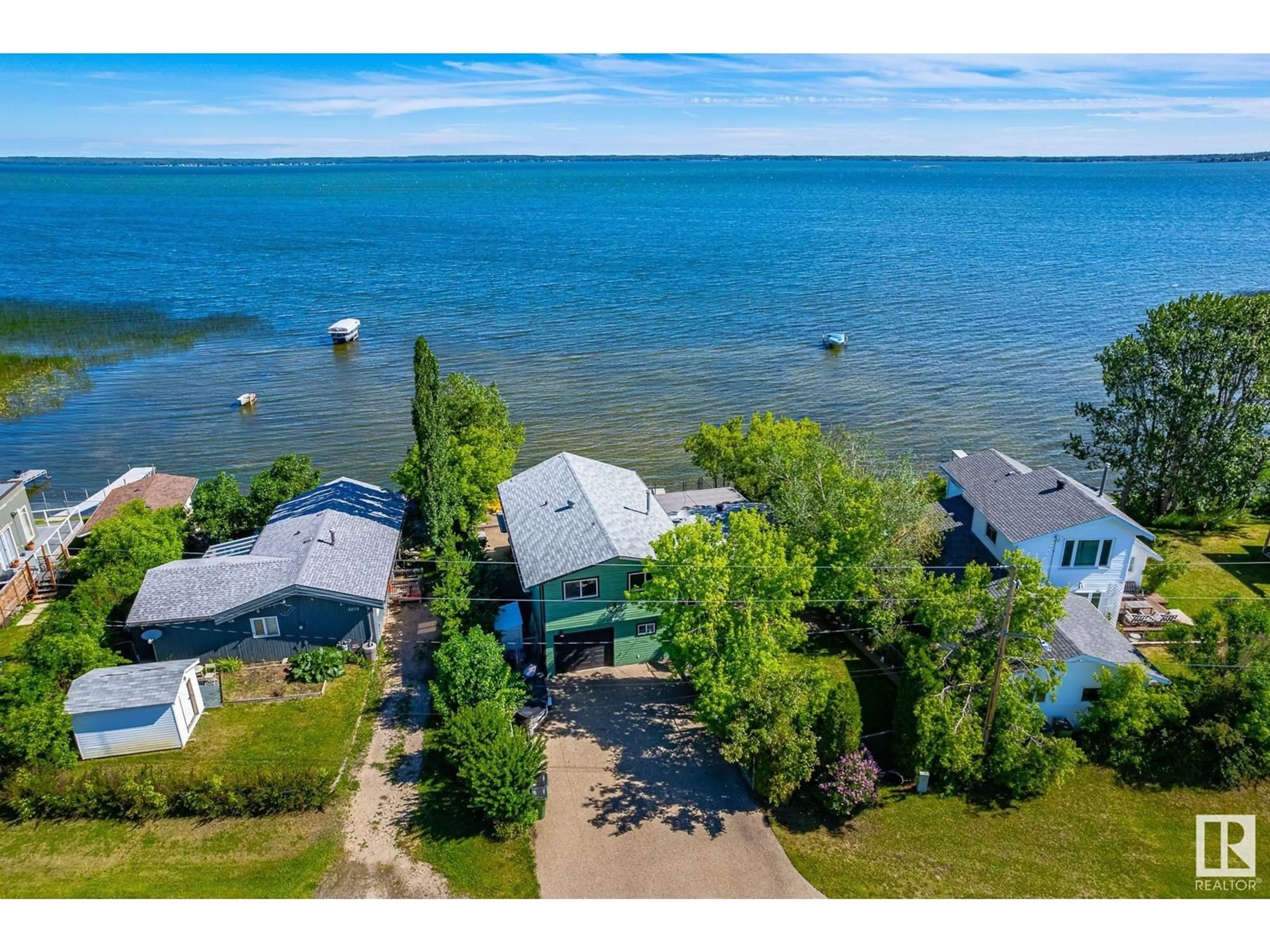 A pic from outside/outdoor area/front of a property/back of a property/a pic from drone, water/lake/river/ocean view for 6816 ST.ANNE TRAIL, Rural Lac Ste. Anne County Alberta T0E0A0