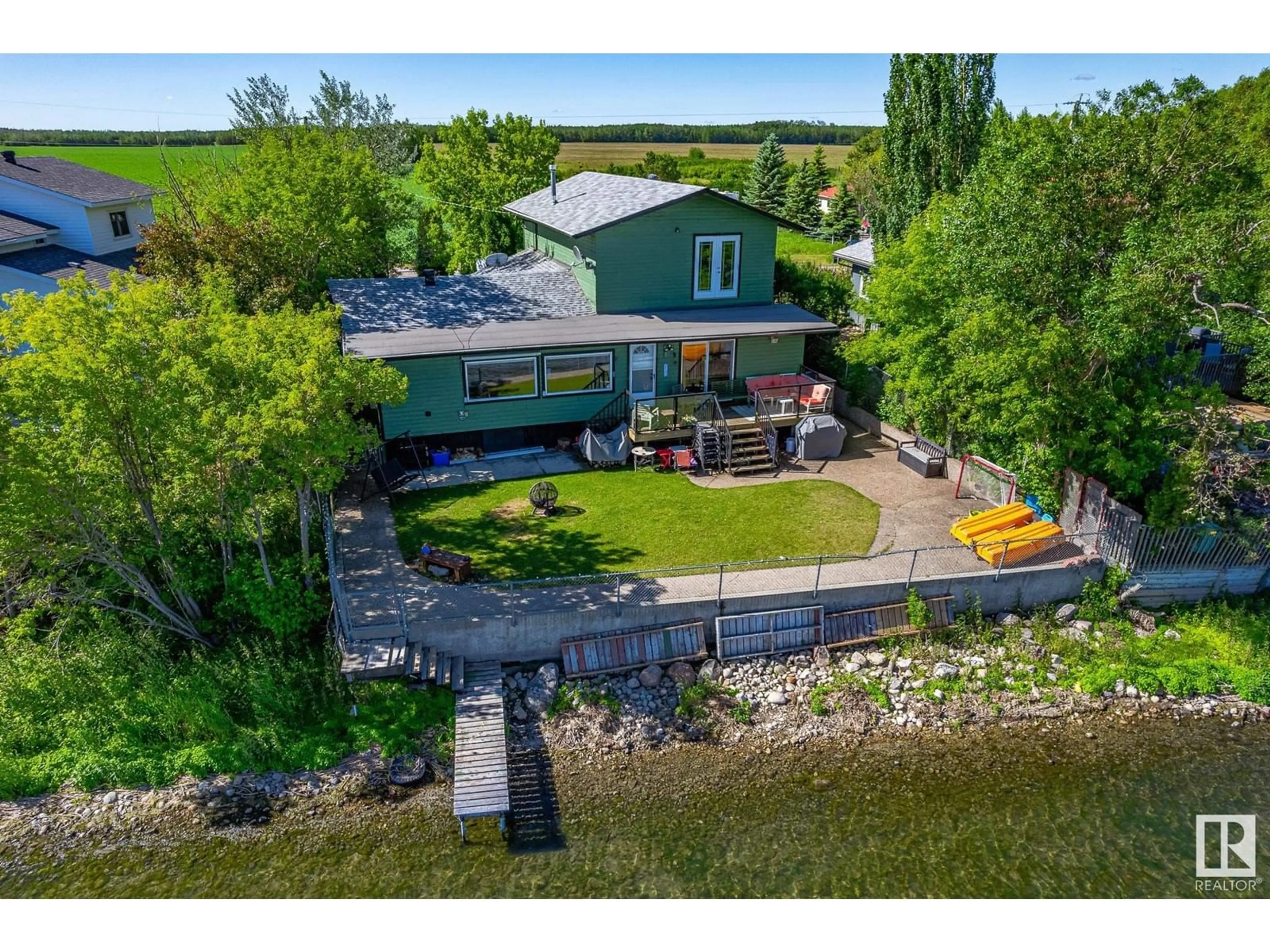 A pic from outside/outdoor area/front of a property/back of a property/a pic from drone, water/lake/river/ocean view for 6816 ST.ANNE TRAIL, Rural Lac Ste. Anne County Alberta T0E0A0