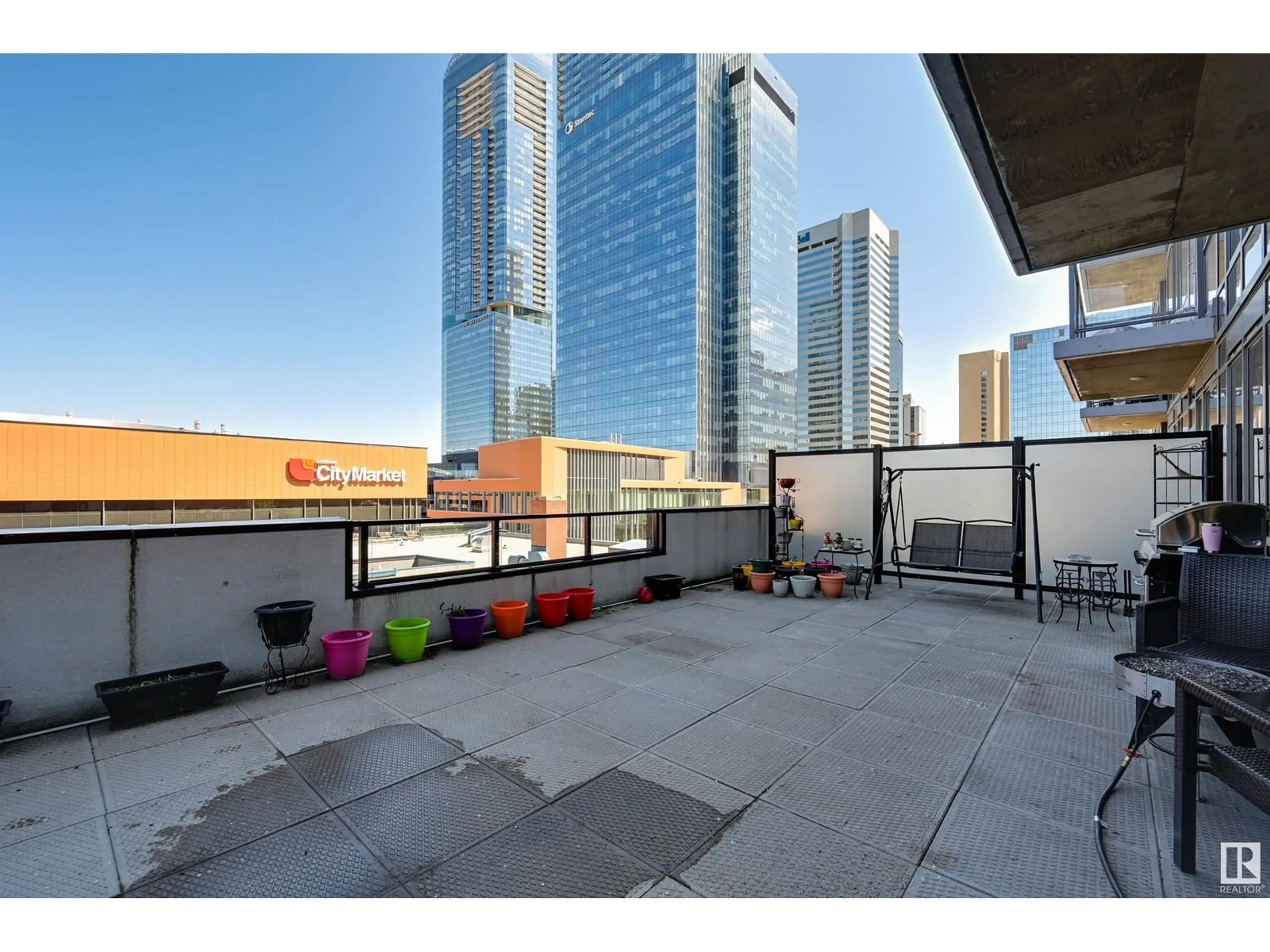 Patio, city buildings view from balcony for #505 10238 103 ST NW, Edmonton Alberta T5J0G6