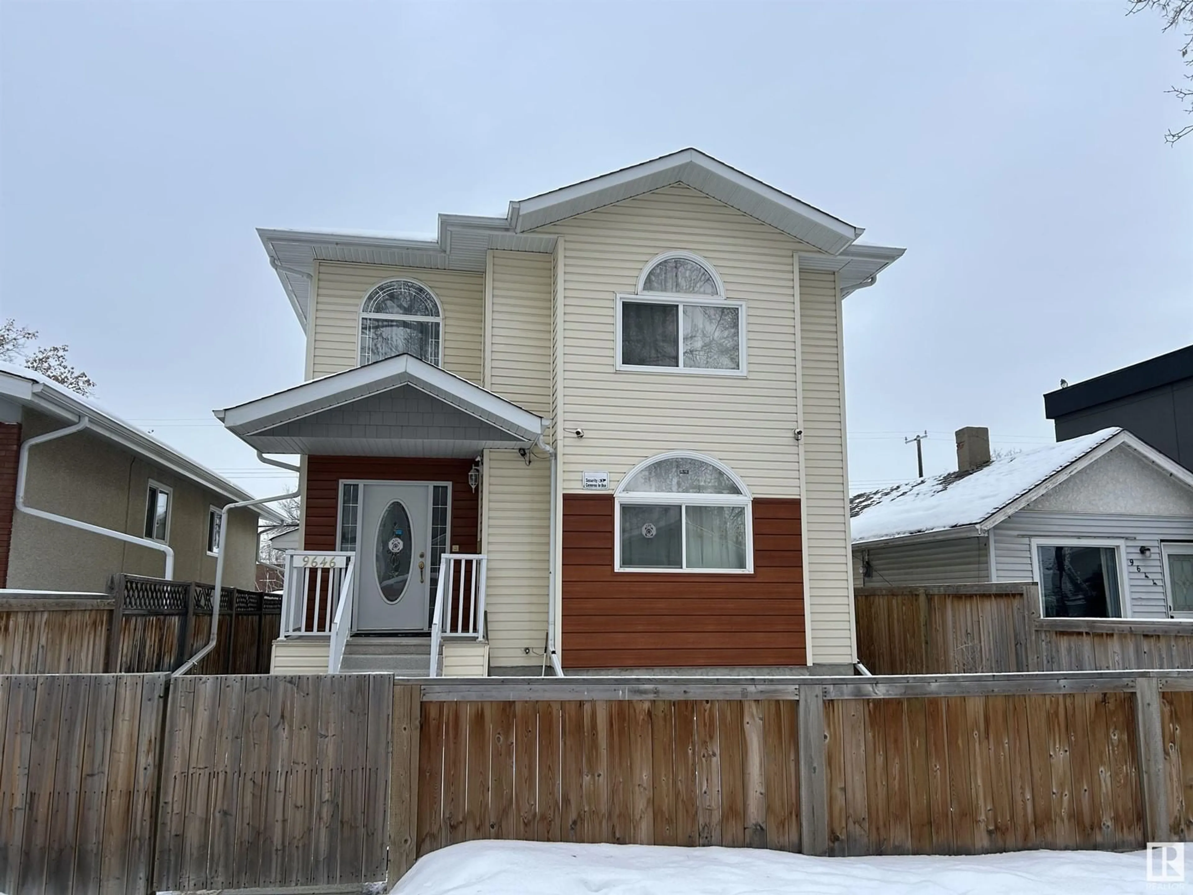 Home with vinyl exterior material, street for 9646 73 AV NW, Edmonton Alberta T6E1B2