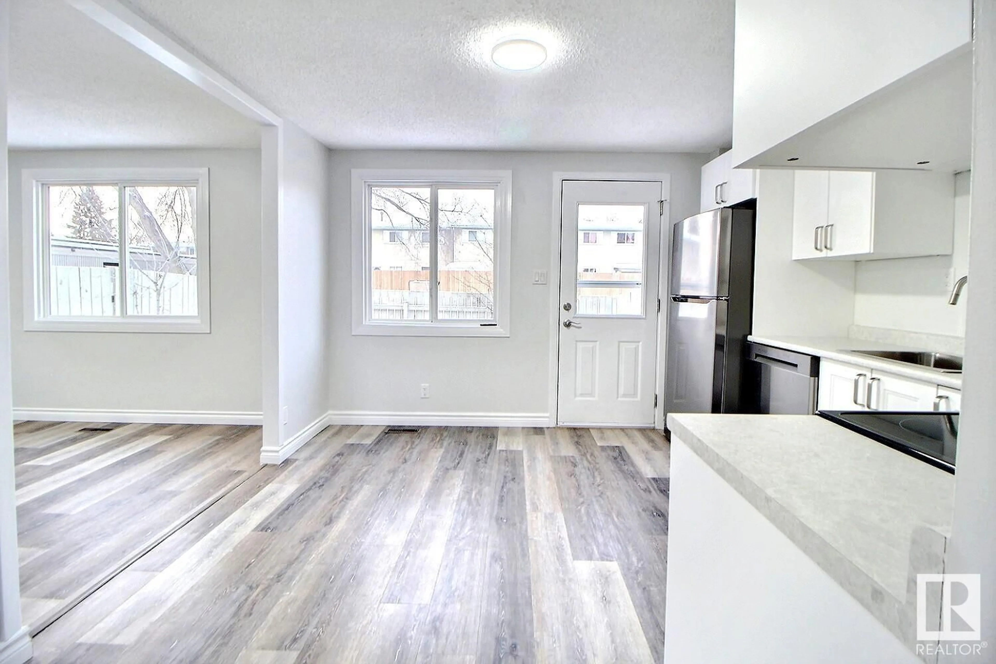 Open concept kitchen, wood/laminate floor for 64 RIDGEWOOD TC, St. Albert Alberta T8N0E9