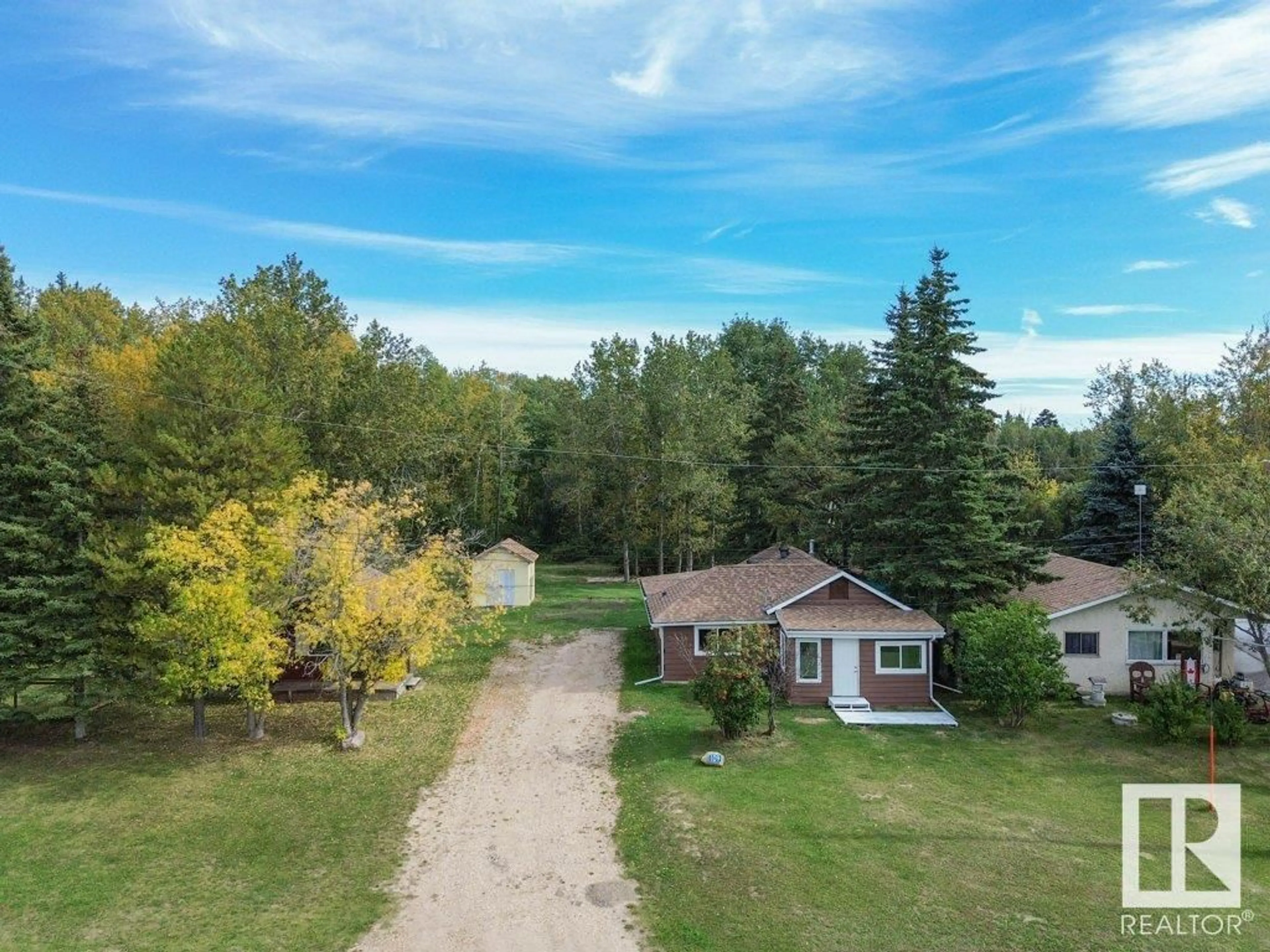 A pic from outside/outdoor area/front of a property/back of a property/a pic from drone, unknown for 55022 STE. ANNE TR, Gunn Alberta T0E0E1