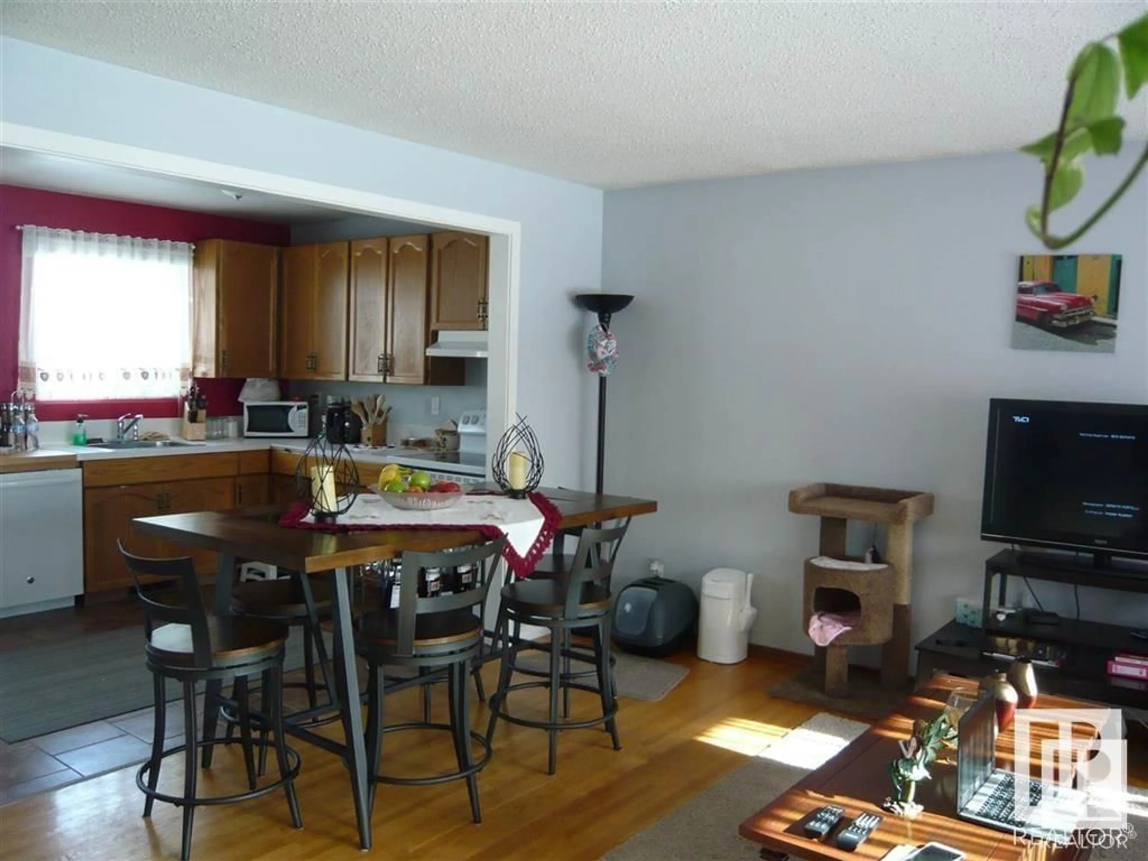 Open concept kitchen, wood/laminate floor for 10428 136 AV NW, Edmonton Alberta T5E1W3