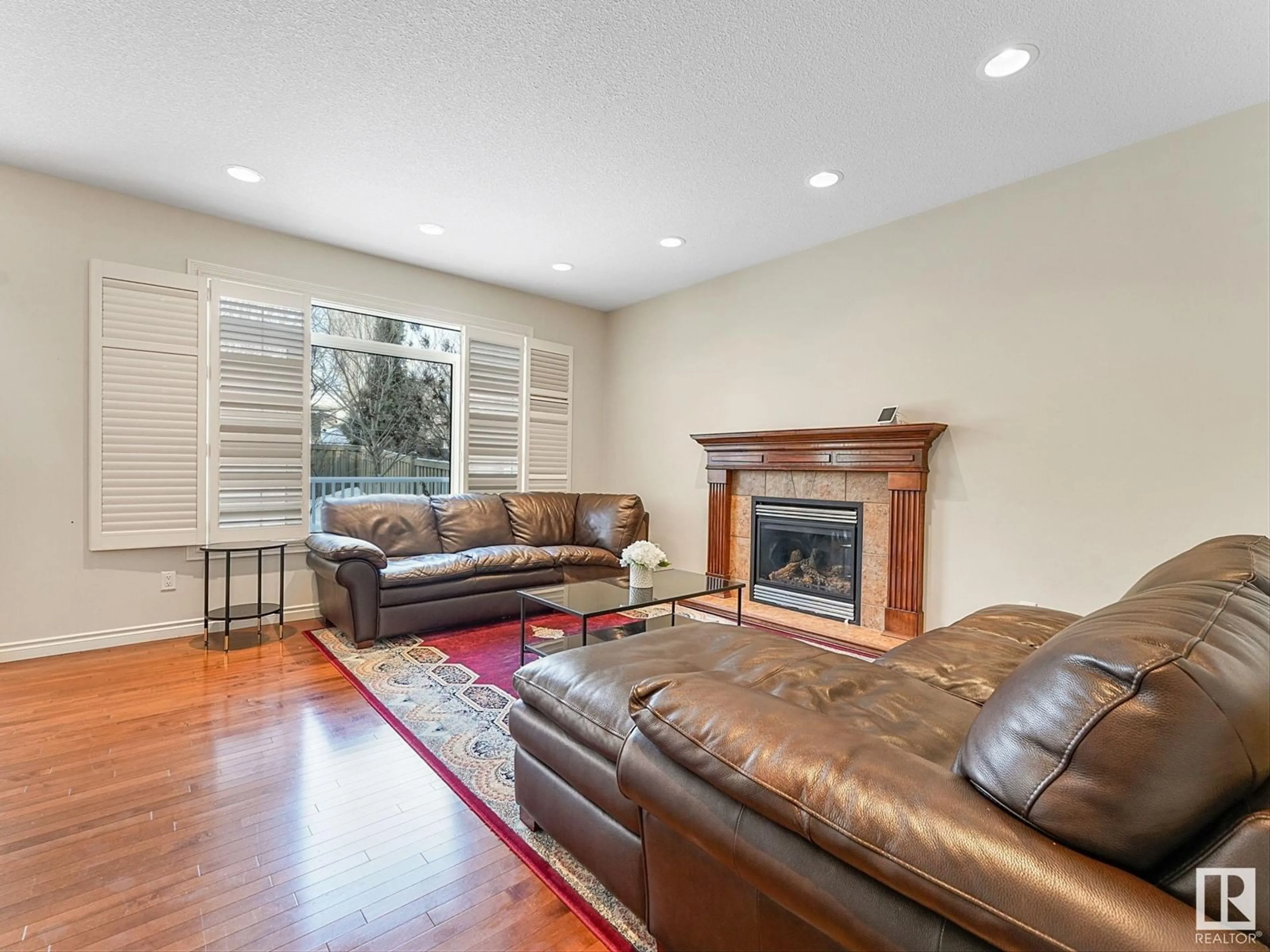 Living room with furniture, wood/laminate floor for 1024 HOPE RD NW, Edmonton Alberta T6M3A1