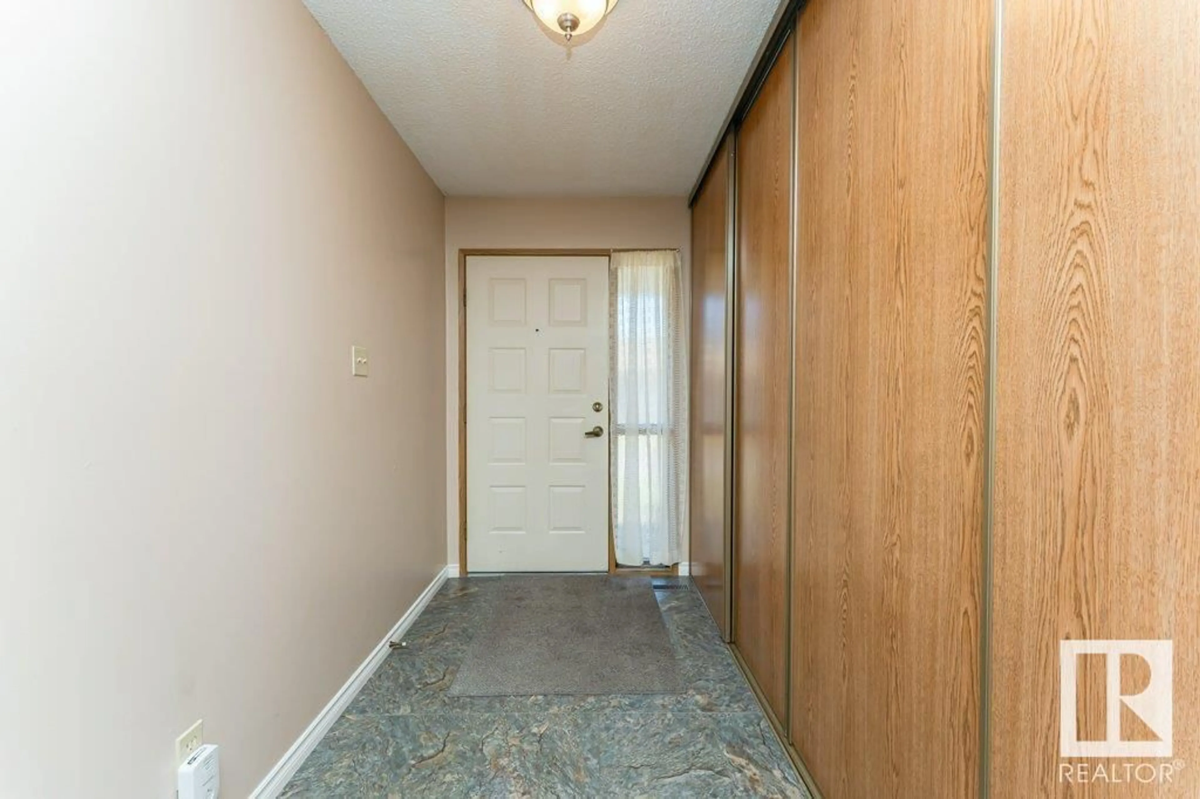 Indoor entryway for 10672 153 AV NW, Edmonton Alberta T5X5R7