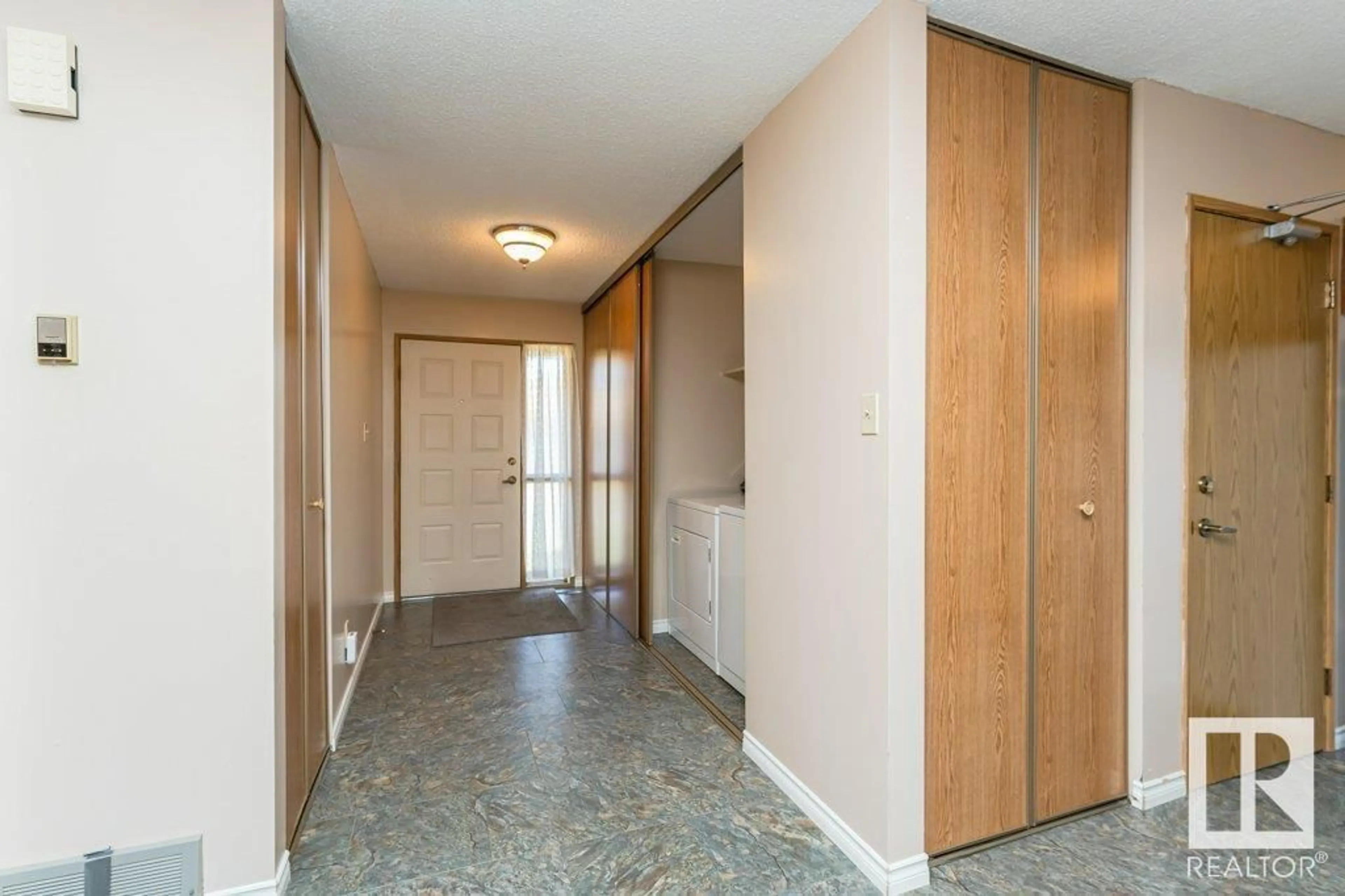 Indoor foyer for 10672 153 AV NW, Edmonton Alberta T5X5R7