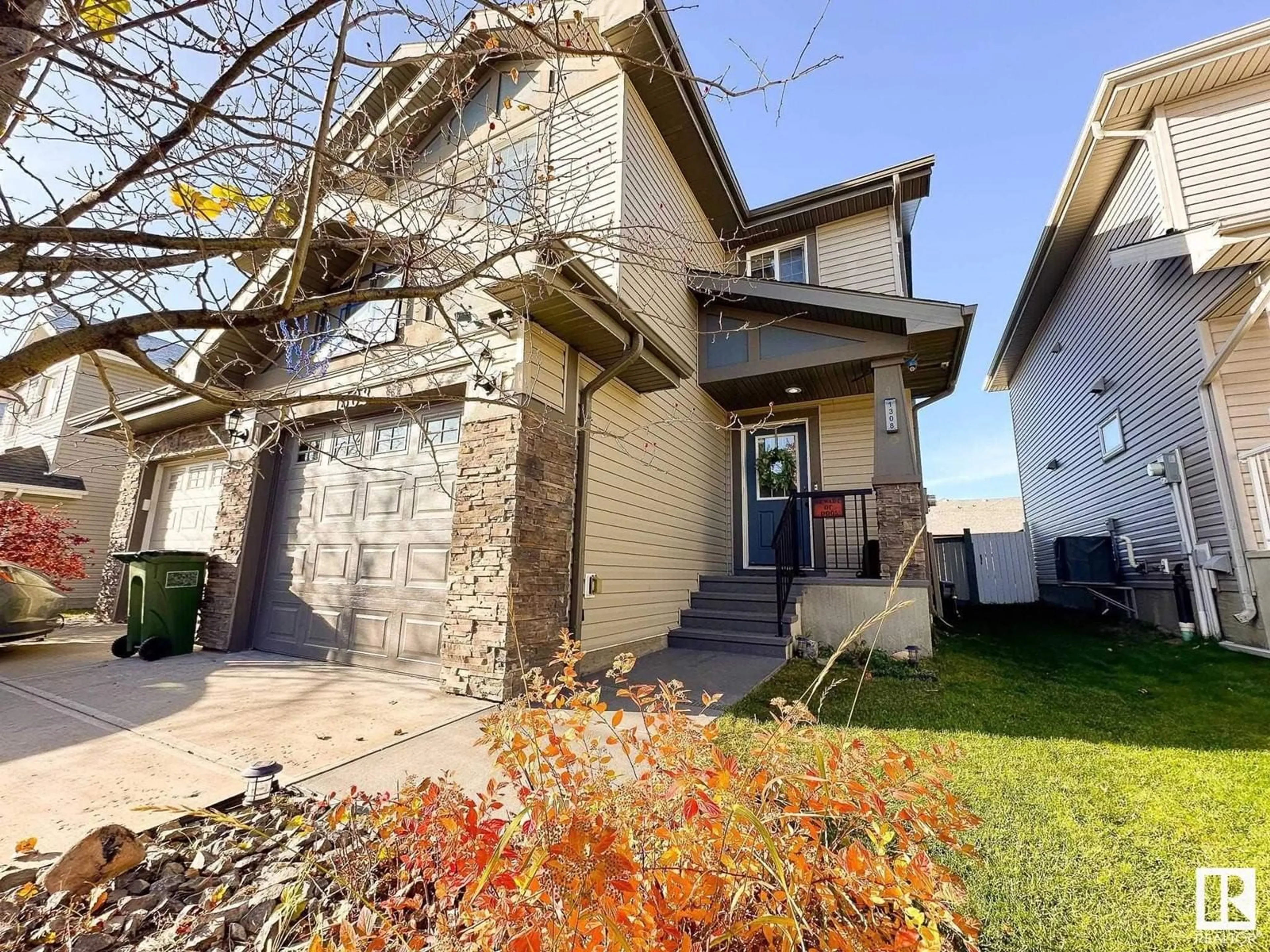 Home with vinyl exterior material, street for 1308 162 ST SW, Edmonton Alberta T6W2L1