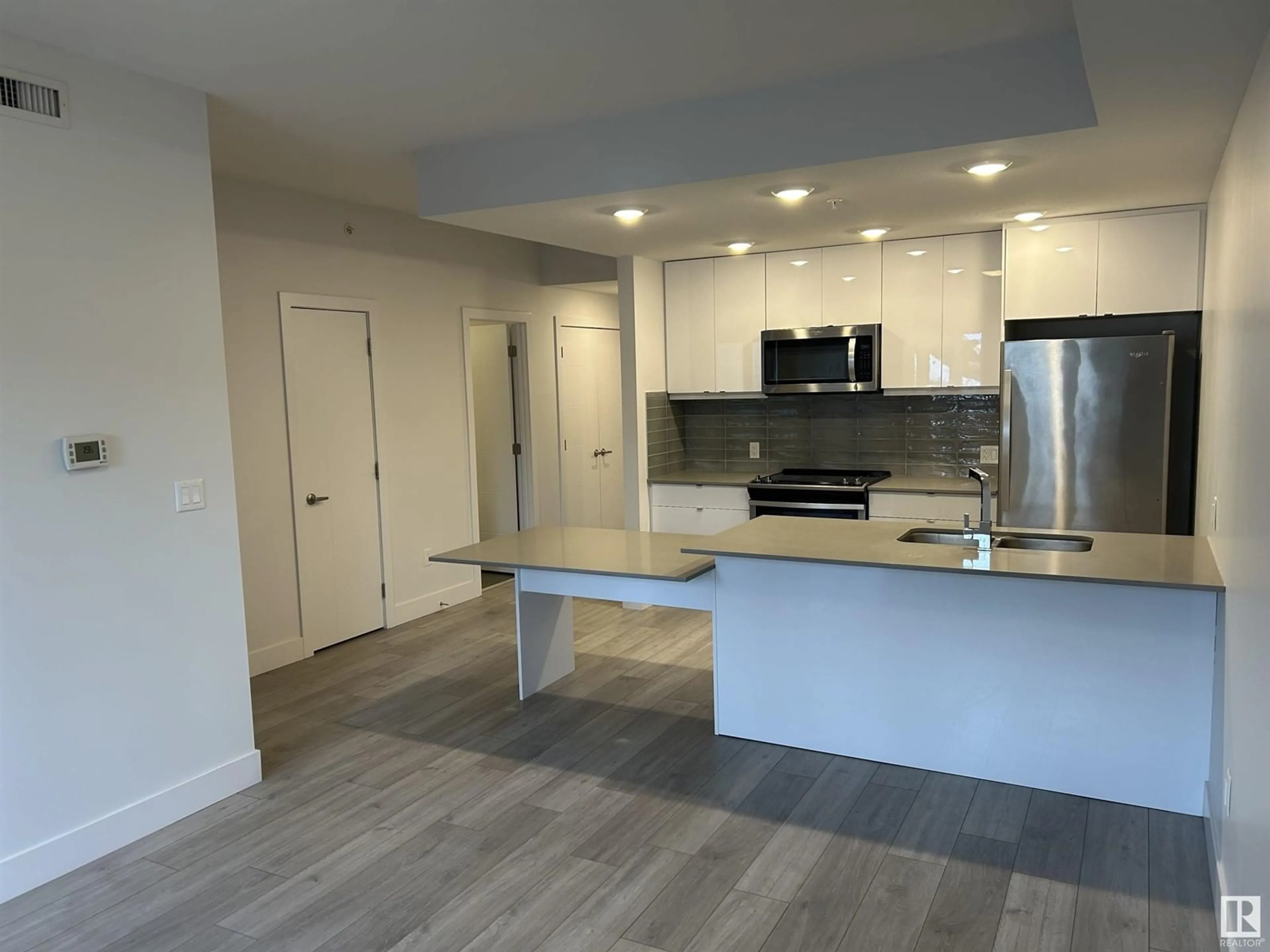 Open concept kitchen, unknown for #107 8510 90 ST NW, Edmonton Alberta T6C3L5