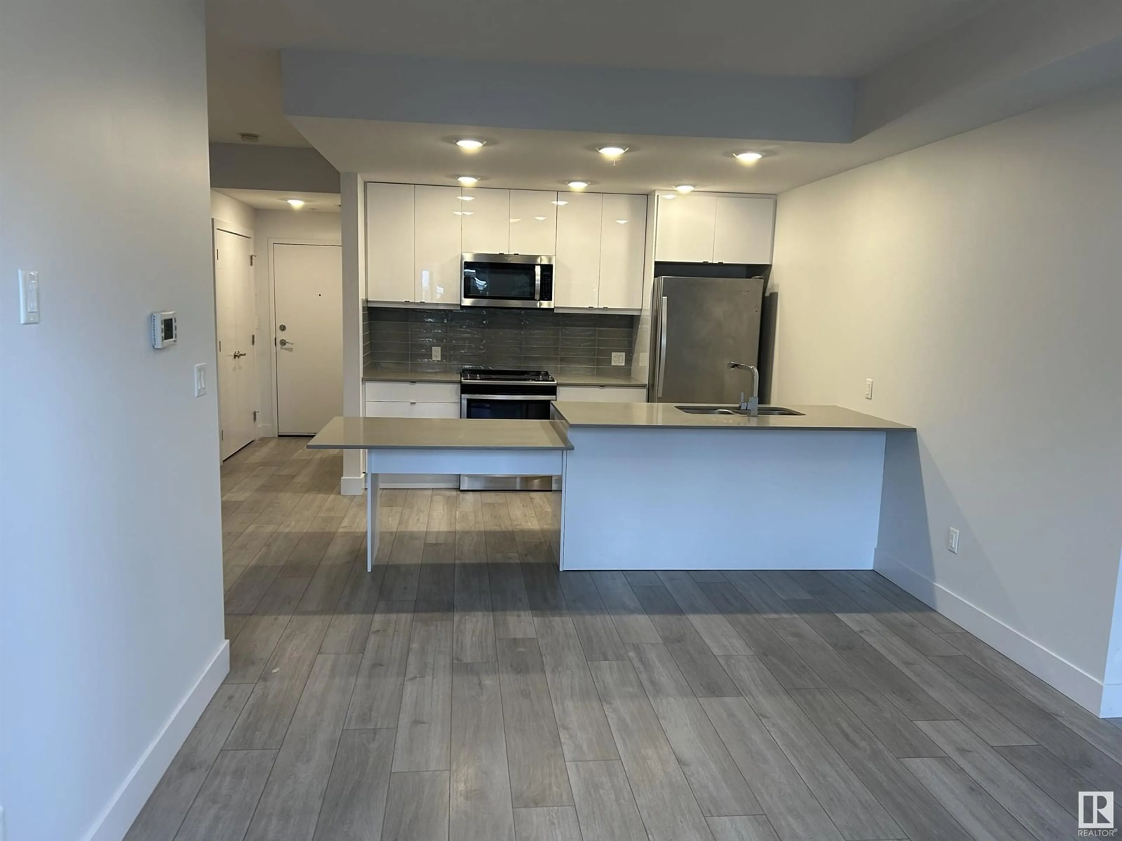 Open concept kitchen, unknown for #107 8510 90 ST NW, Edmonton Alberta T6C3L5