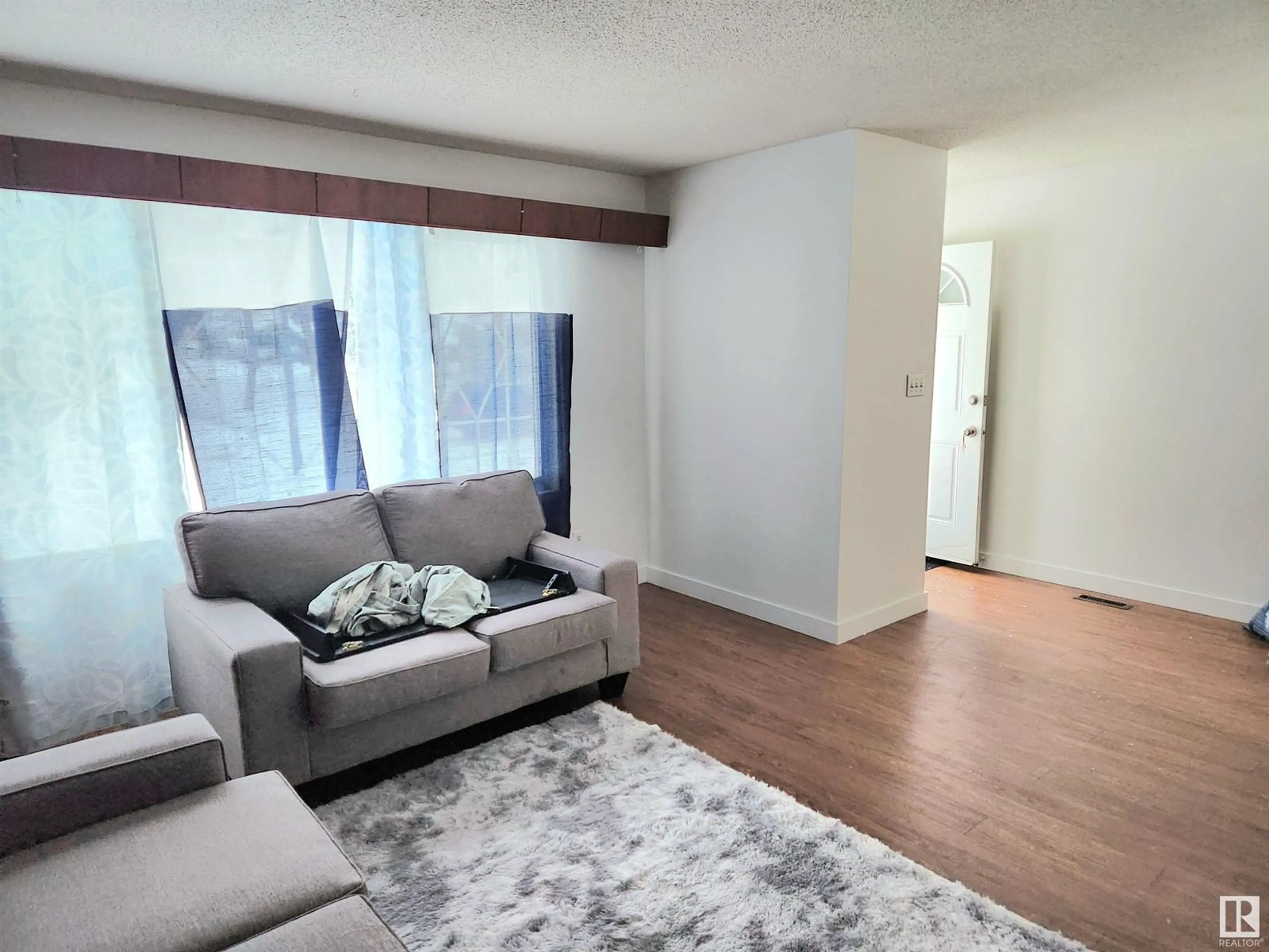 Living room with furniture, unknown for 12245 86 ST NW, Edmonton Alberta T5B3K8