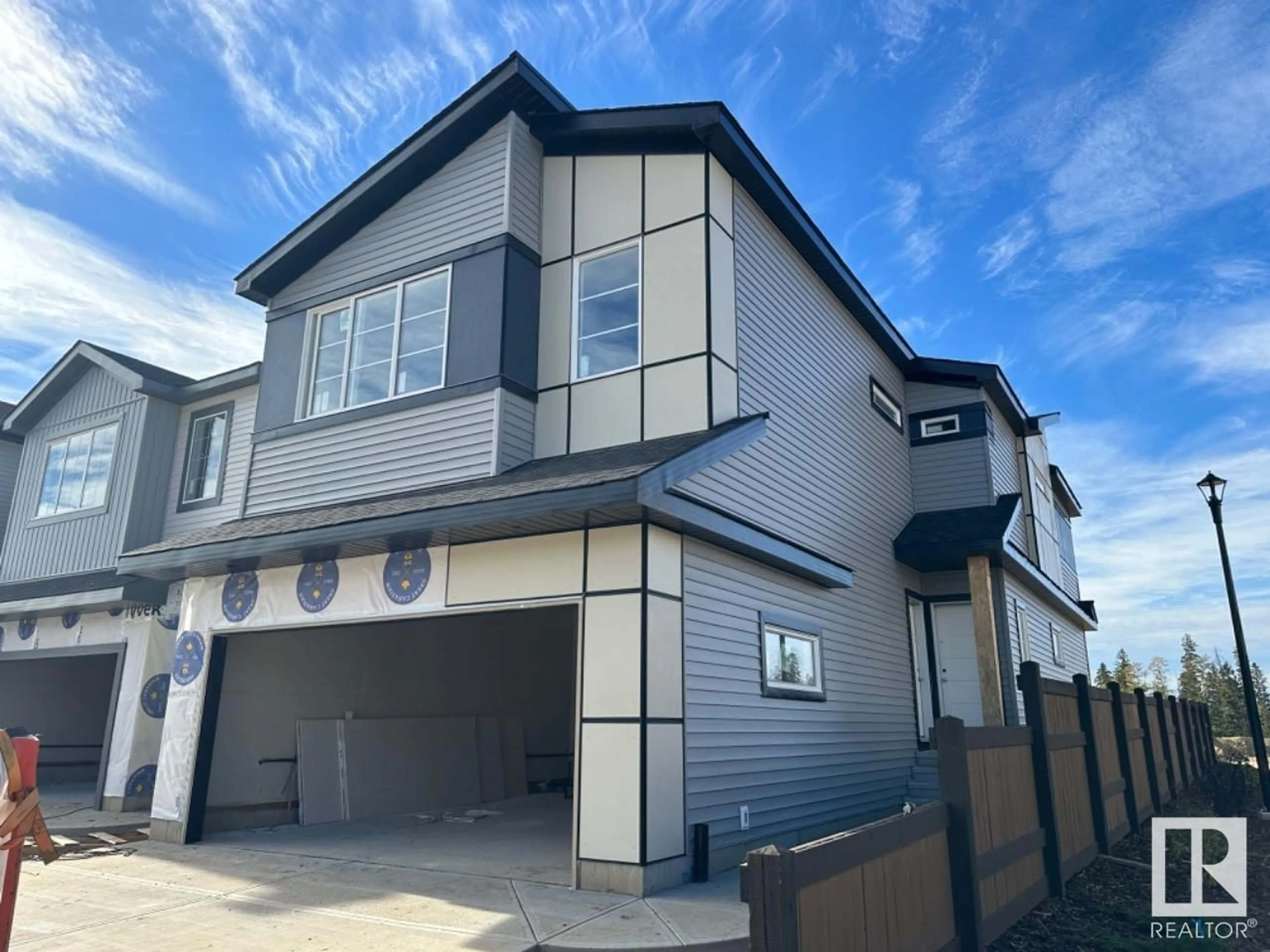 Home with vinyl exterior material, street for 653 KINGLET BV NW, Edmonton Alberta T5S2B9