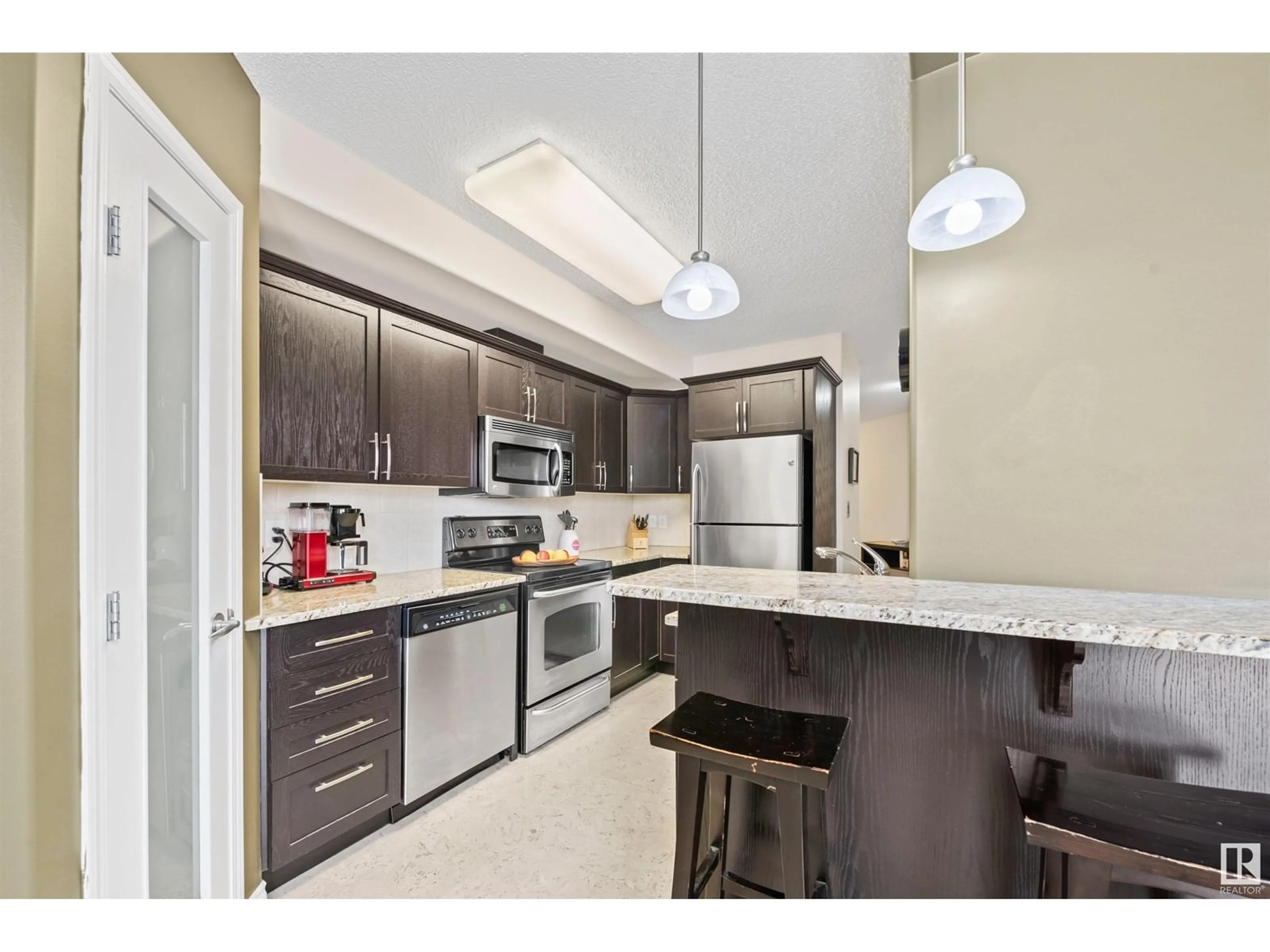 Standard kitchen, ceramic/tile floor for #201 9707 106 ST NW, Edmonton Alberta T5K0B7