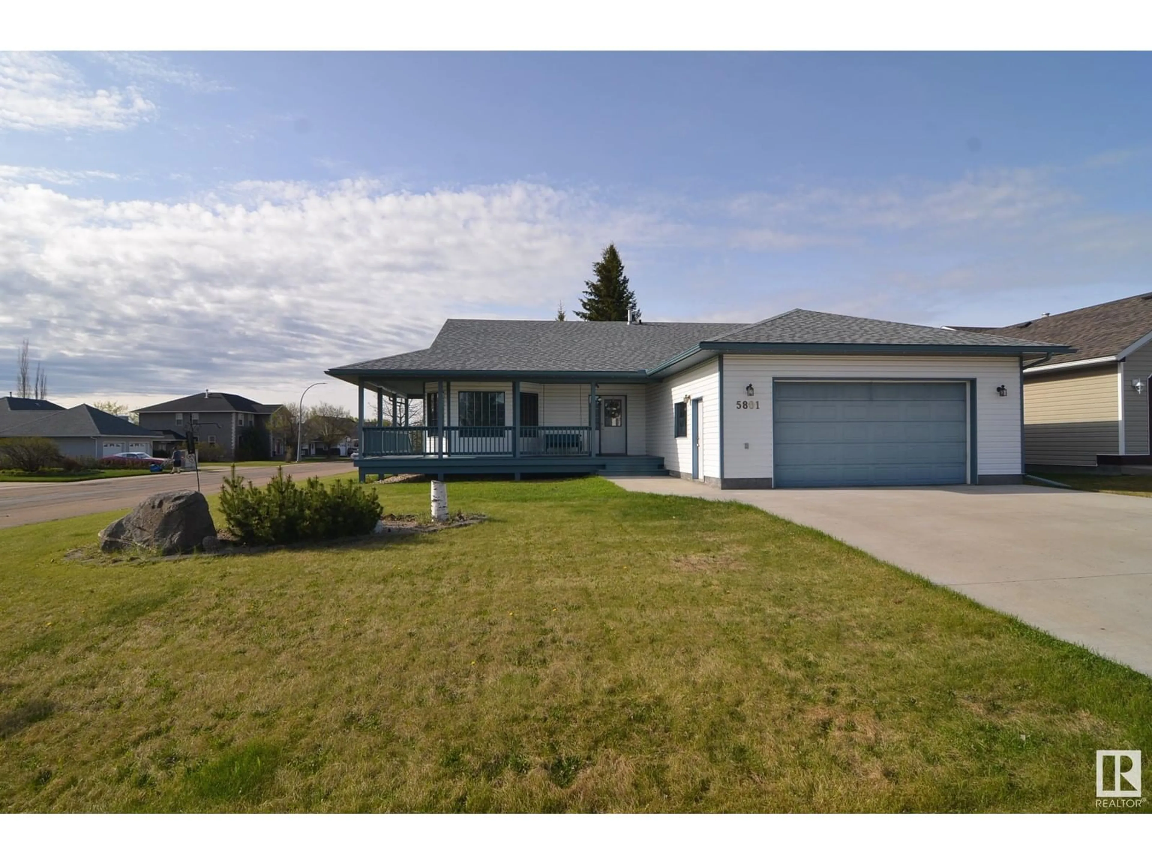 Home with vinyl exterior material, street for 5803 50 AVE, Barrhead Alberta T7N1N8