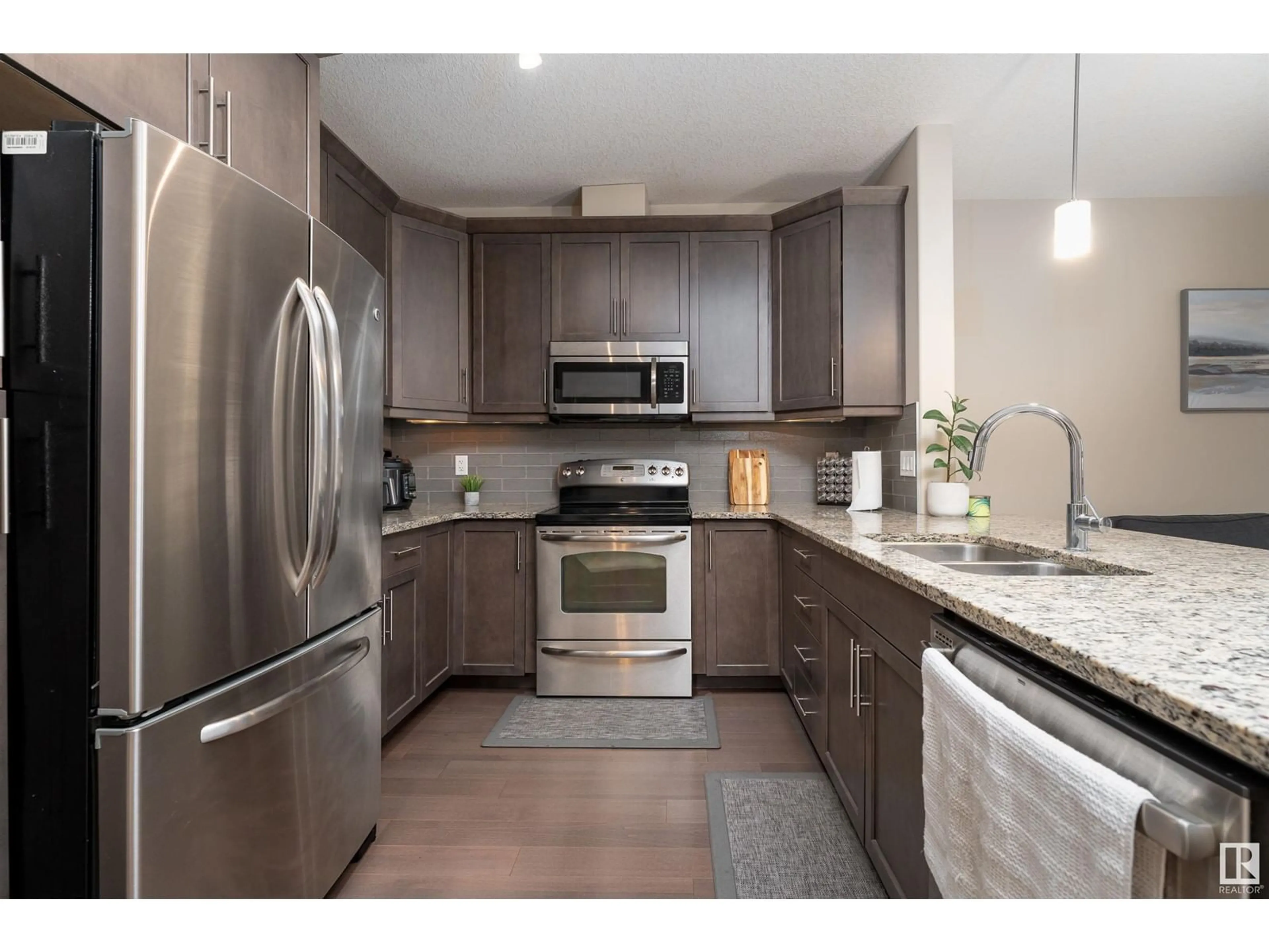 Open concept kitchen, unknown for #347 6079 MAYNARD WY NW, Edmonton Alberta T6R0S4