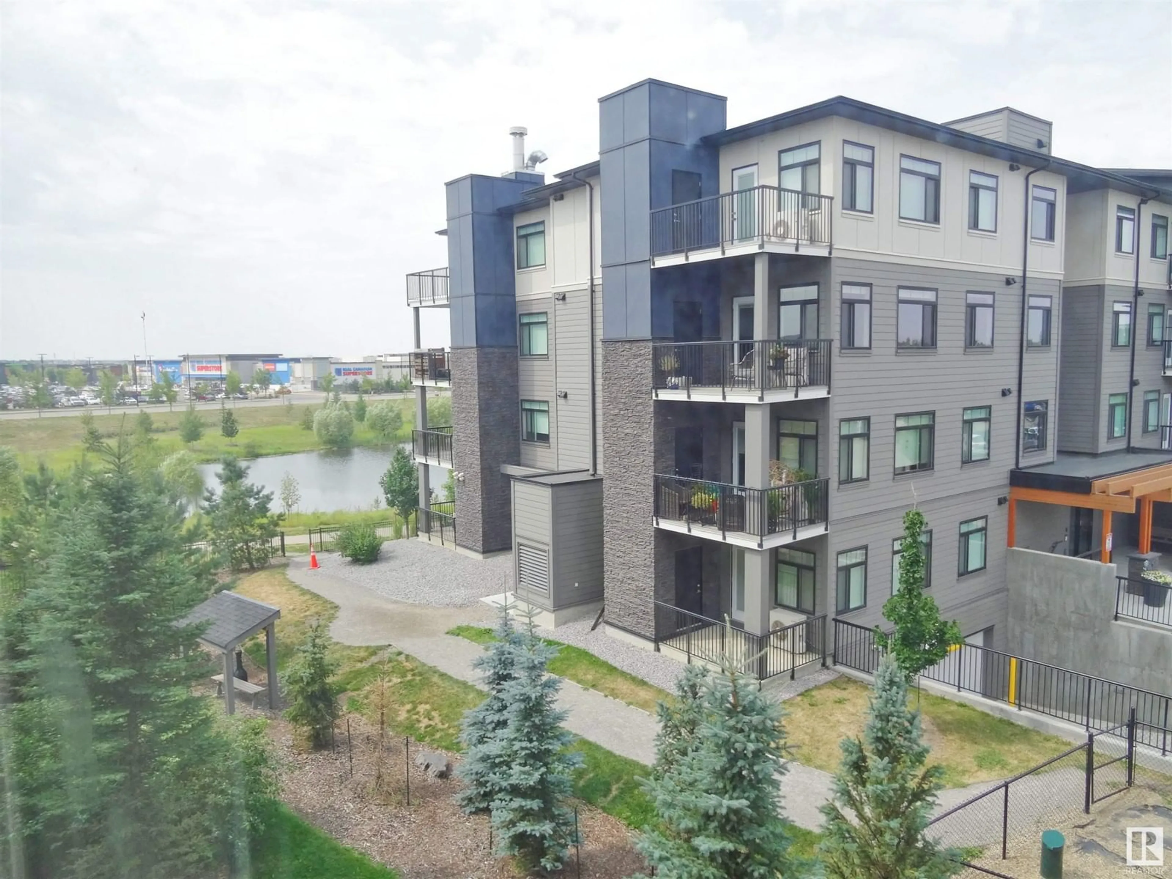 A pic from outside/outdoor area/front of a property/back of a property/a pic from drone, city buildings view from balcony for #319 11803 22 AV SW, Edmonton Alberta T6W2R9