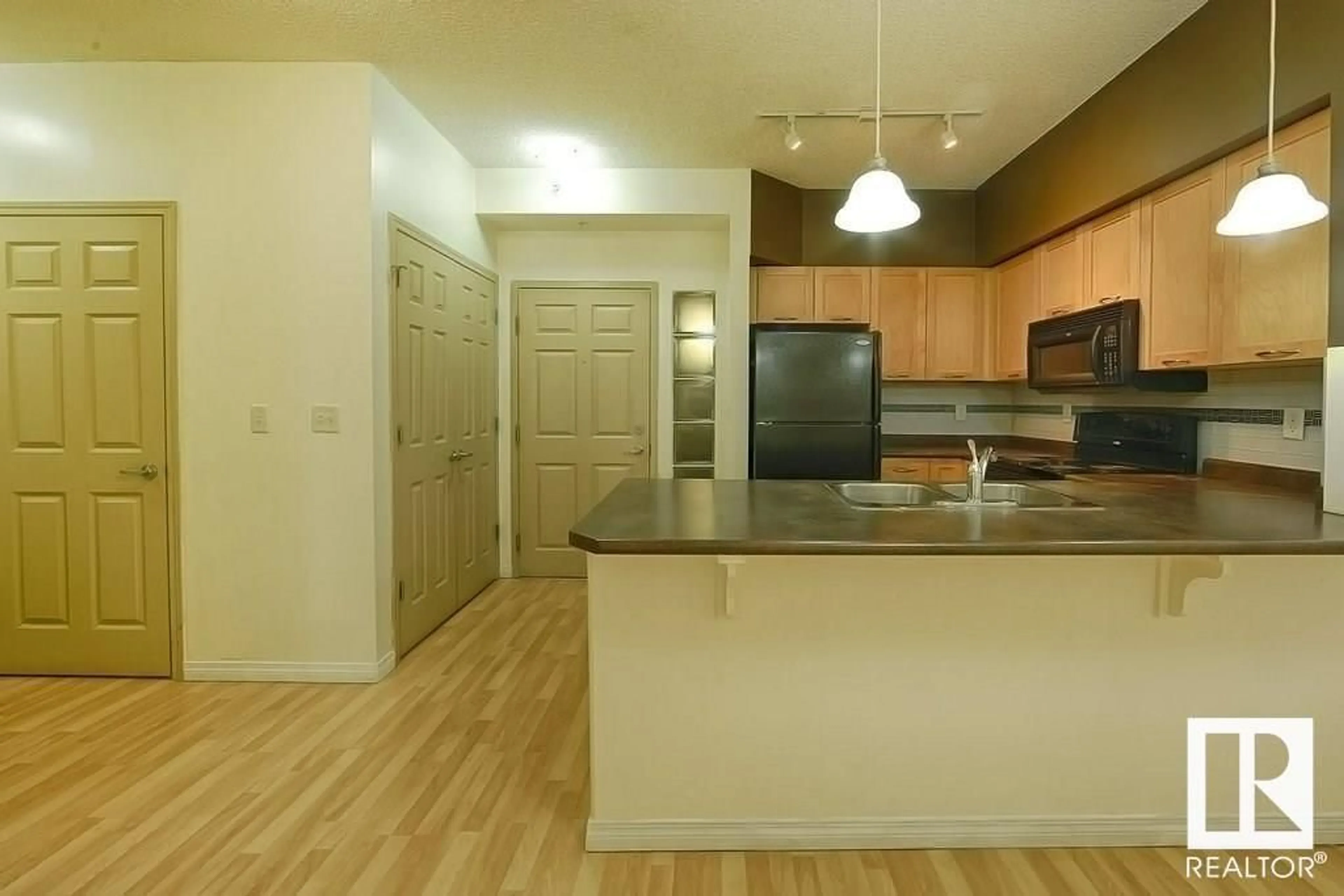 Standard kitchen, wood/laminate floor for #2-116 4245 139 AV NW, Edmonton Alberta T5Y3E8