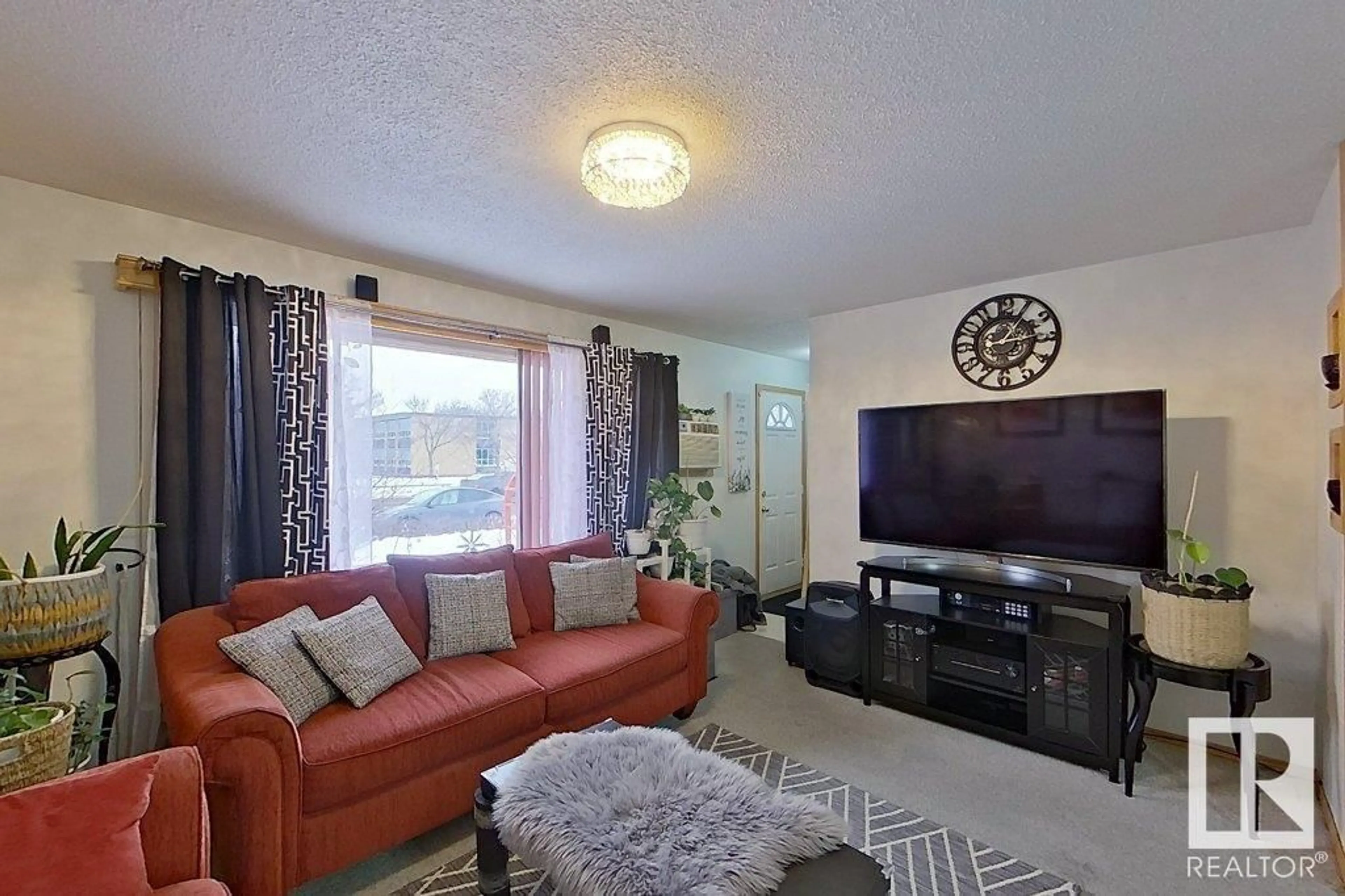 Living room with furniture, unknown for 9422 132 AV NW, Edmonton Alberta T5E0Y3