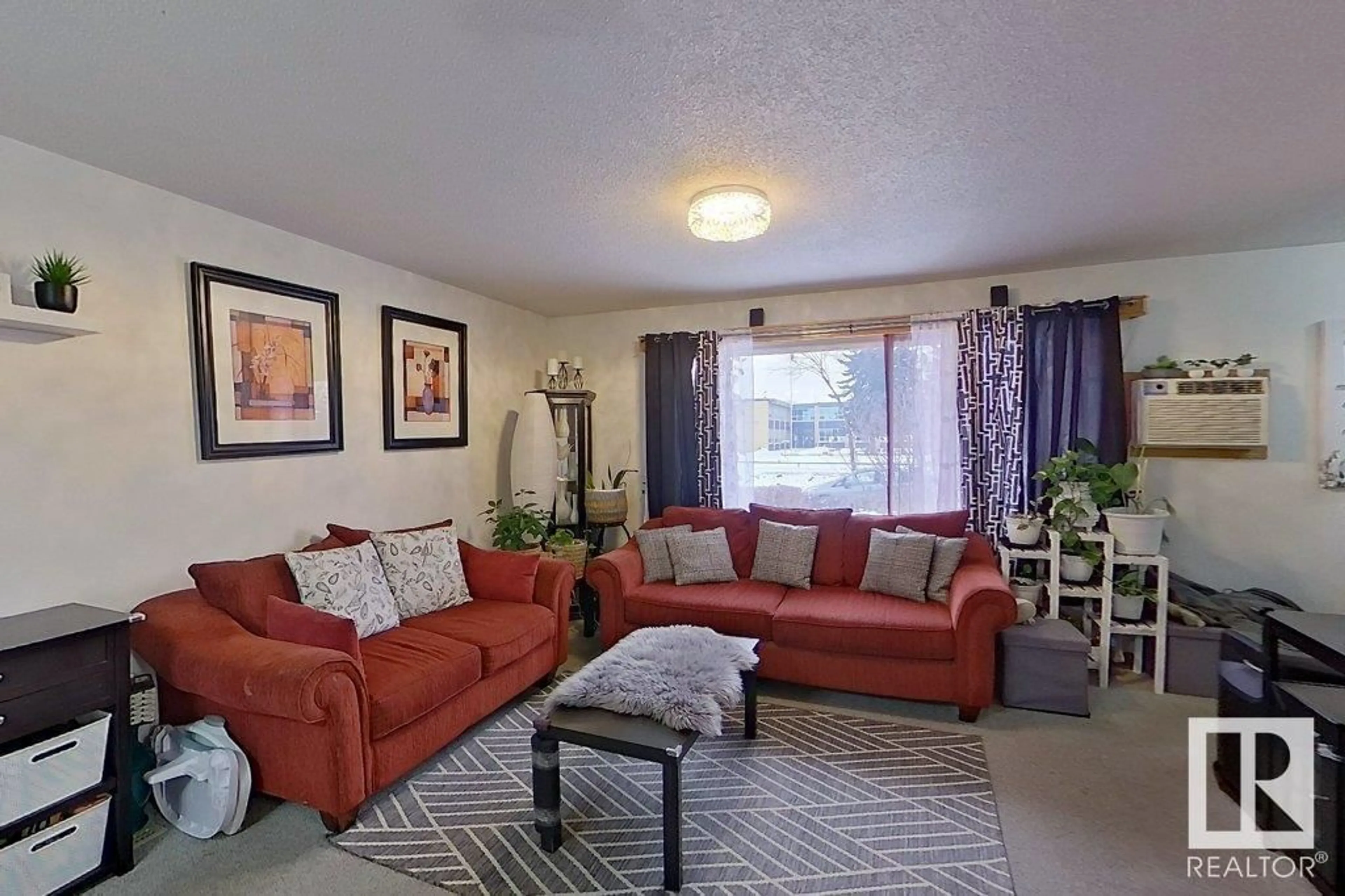 Living room with furniture, unknown for 9422 132 AV NW, Edmonton Alberta T5E0Y3