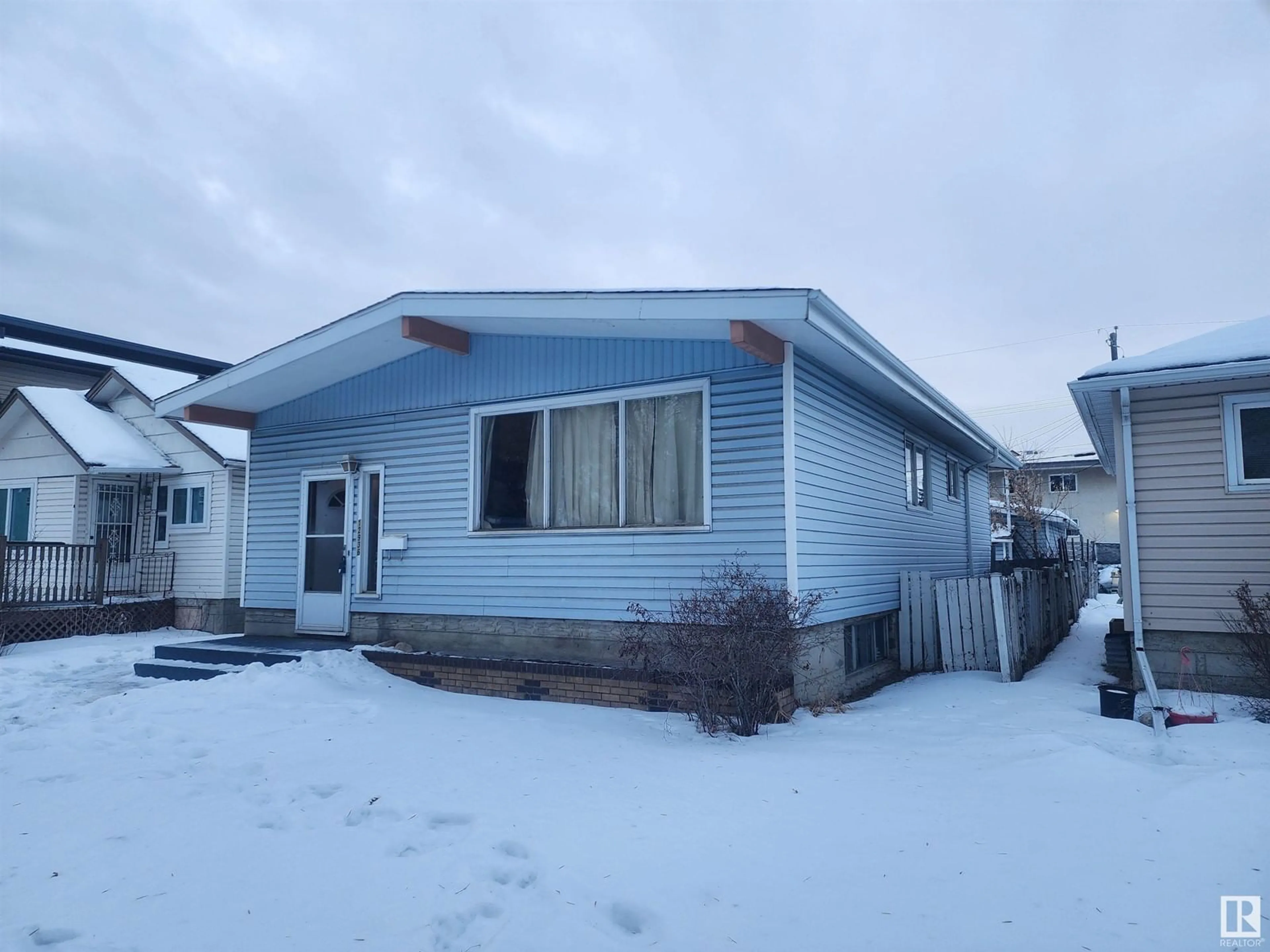 Home with vinyl exterior material, street for 12936 126 ST NW, Edmonton Alberta T5L0Y3