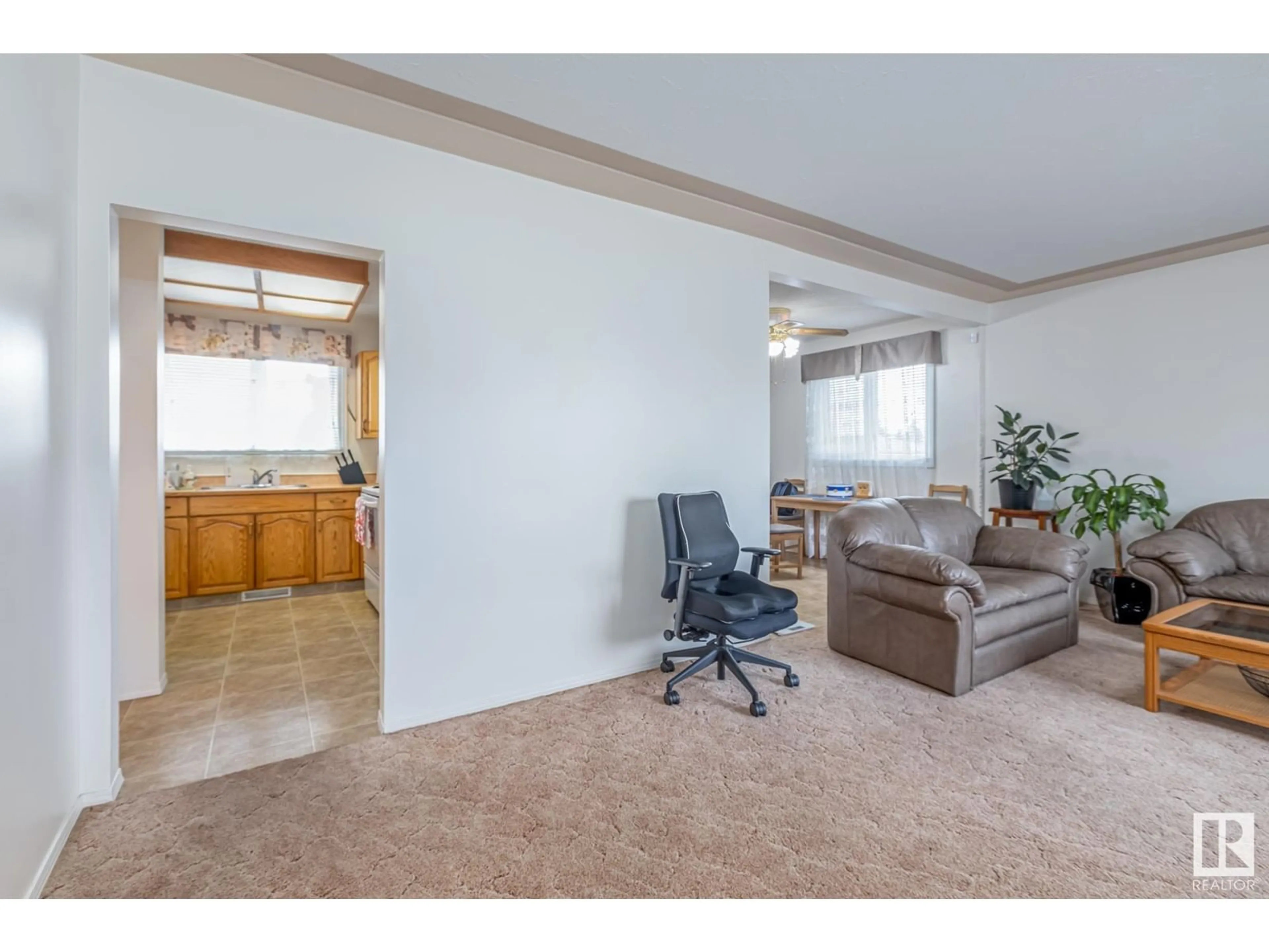 Living room with furniture, unknown for 7607 128 AV NW, Edmonton Alberta T5C1T3