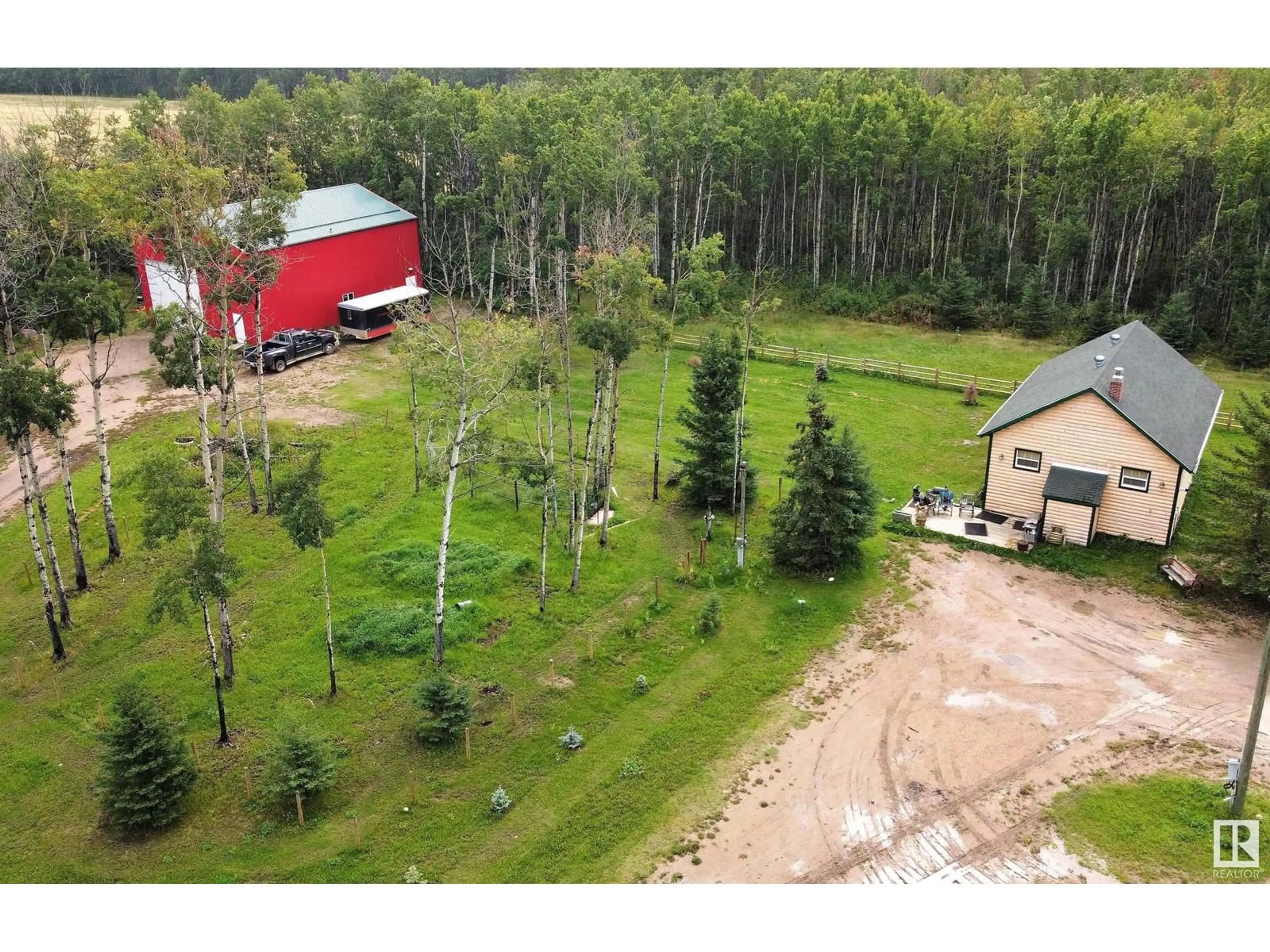 A pic from outside/outdoor area/front of a property/back of a property/a pic from drone, forest/trees view for 63513 RGE RD 471, Rural Bonnyville M.D. Alberta T9N2J6
