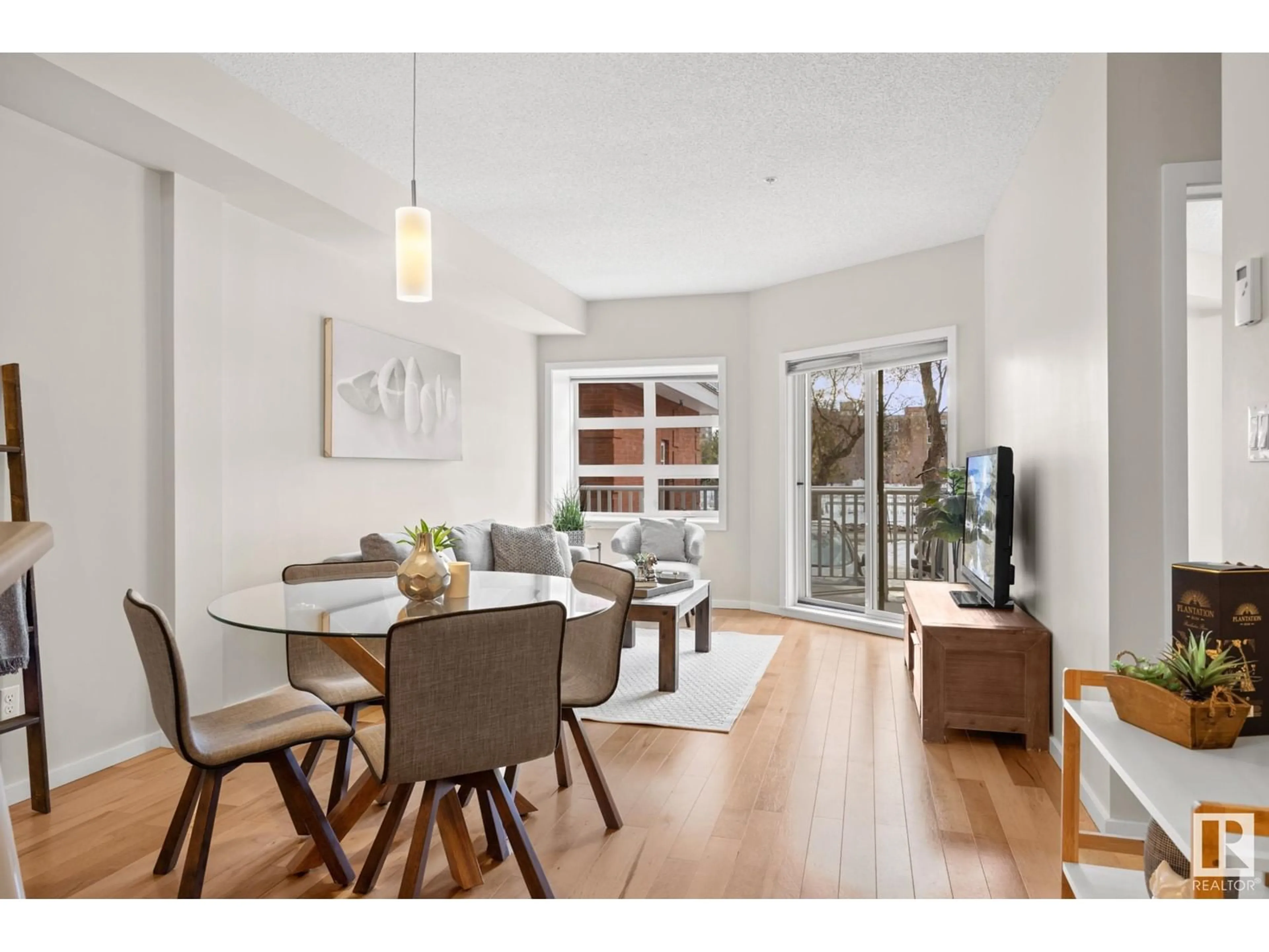 Dining room, wood/laminate floor for #106 9910 111 ST NW NW, Edmonton Alberta T5K1K2