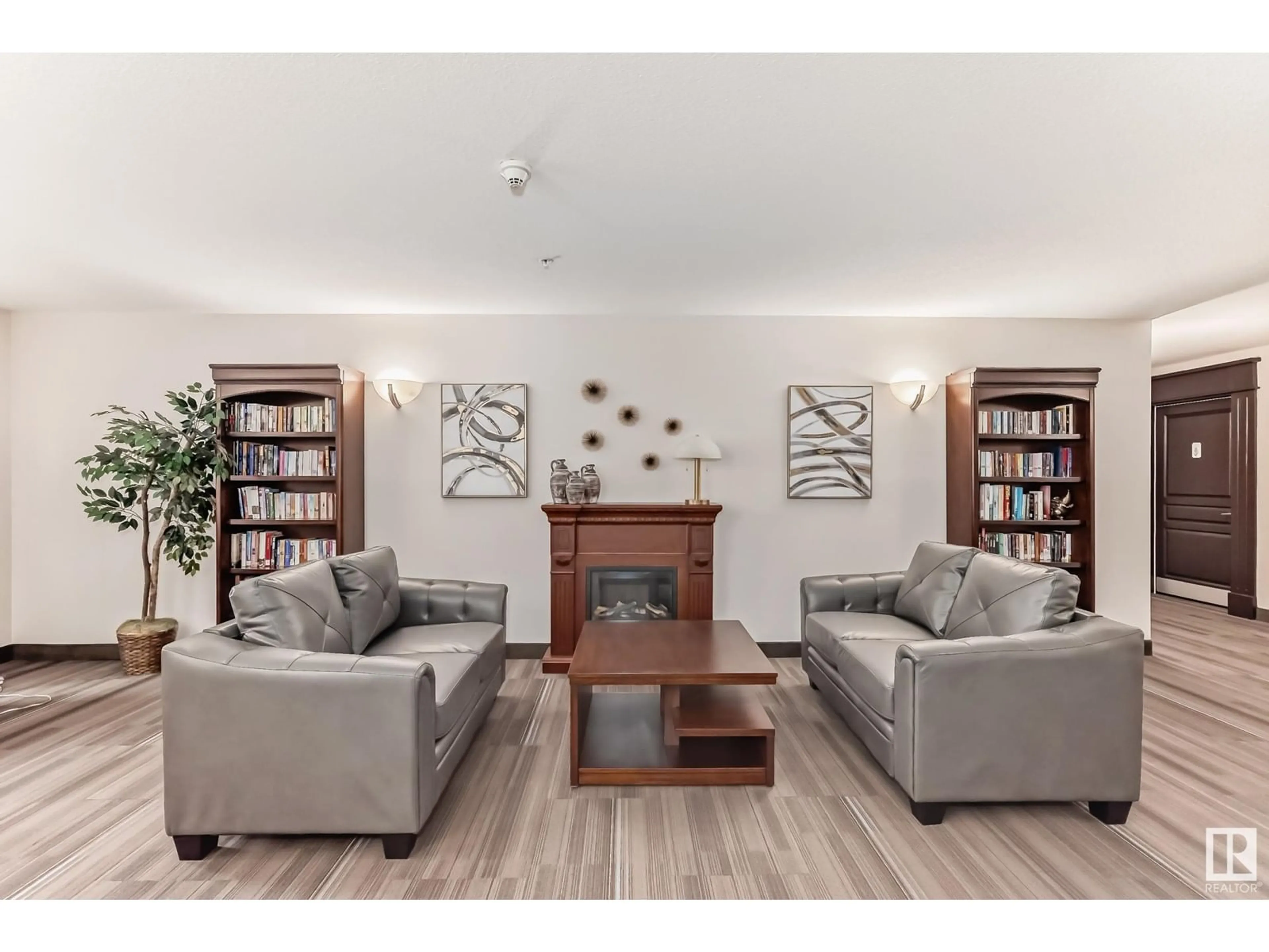 Living room with furniture, wood/laminate floor for #215 300 PALISADES WY, Sherwood Park Alberta T8H2T9