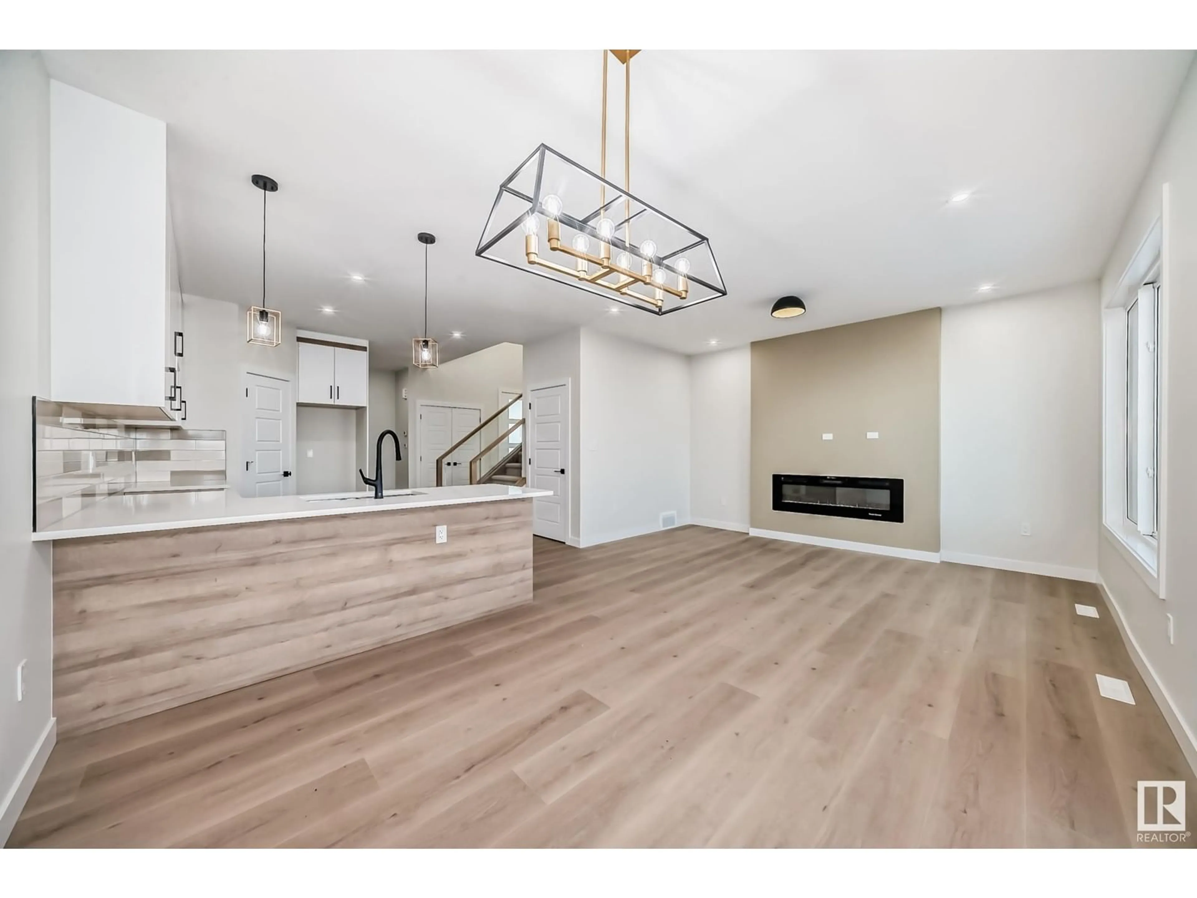 Open concept kitchen, wood/laminate floor for 3722 67 ST, Beaumont Alberta T6L7B7