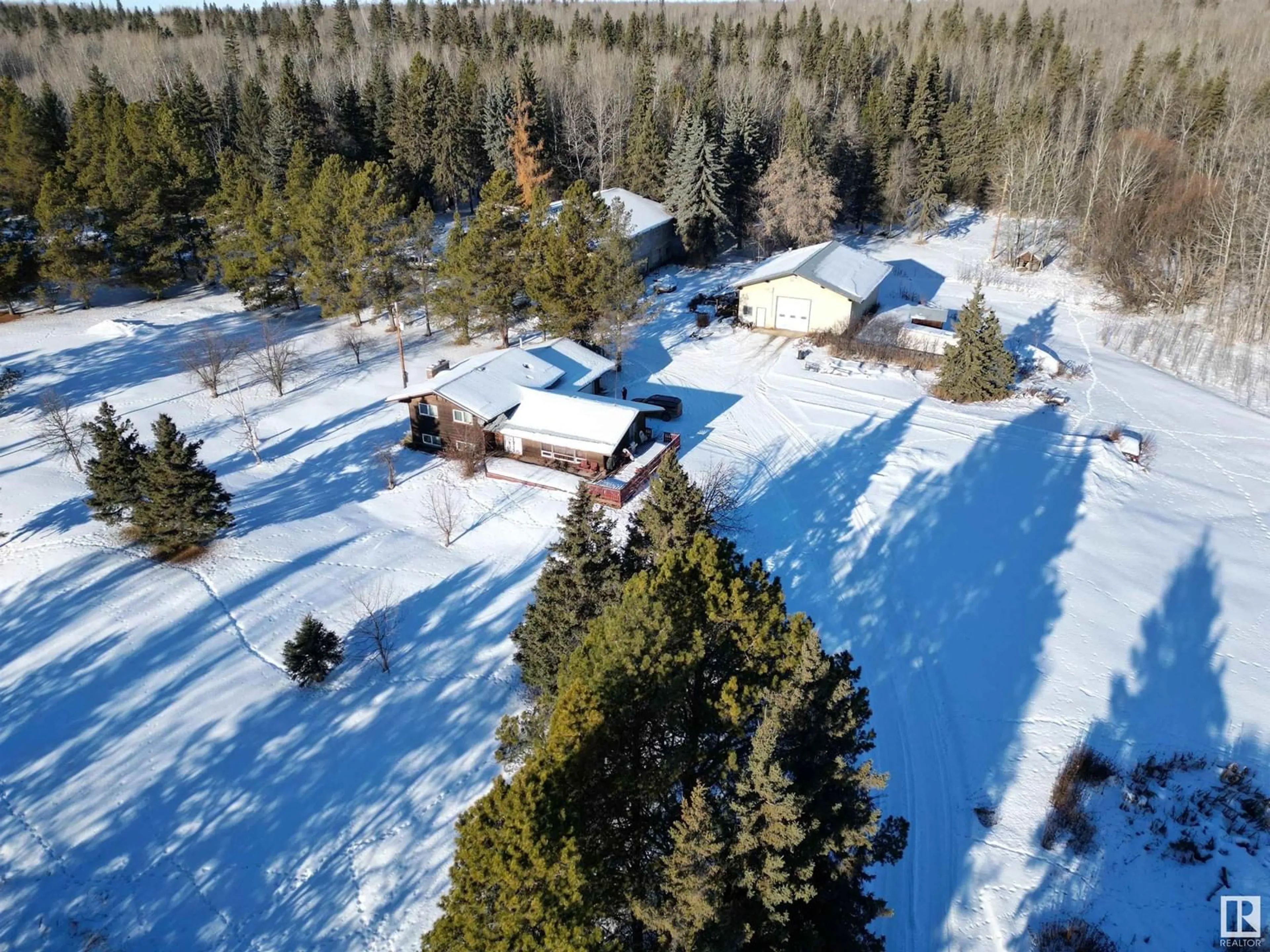 A pic from outside/outdoor area/front of a property/back of a property/a pic from drone, forest/trees view for 4012 HGHWAY 16, Rural Parkland County Alberta T0E2K0