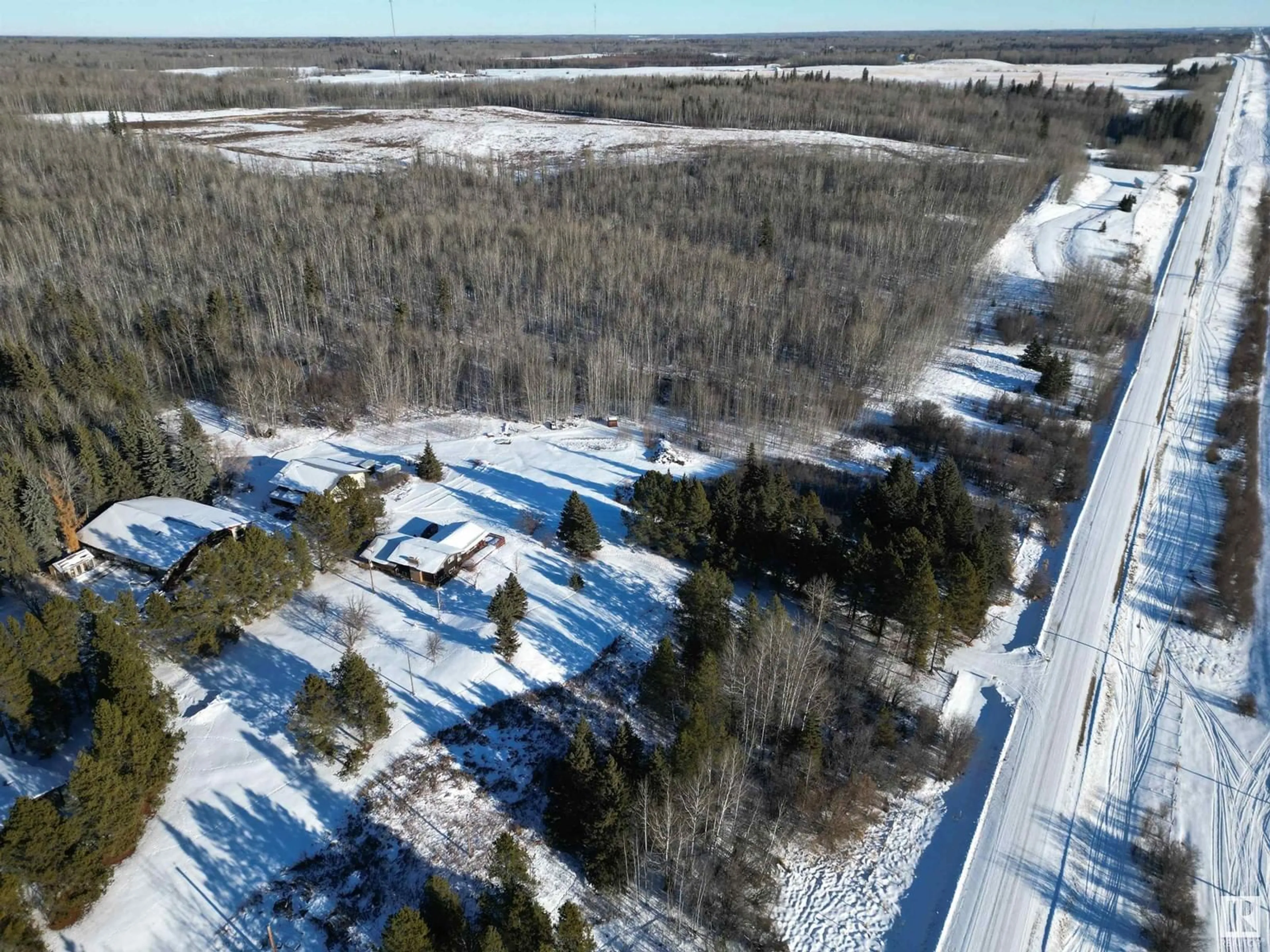 A pic from outside/outdoor area/front of a property/back of a property/a pic from drone, forest/trees view for 4012 HGHWAY 16, Rural Parkland County Alberta T0E2K0
