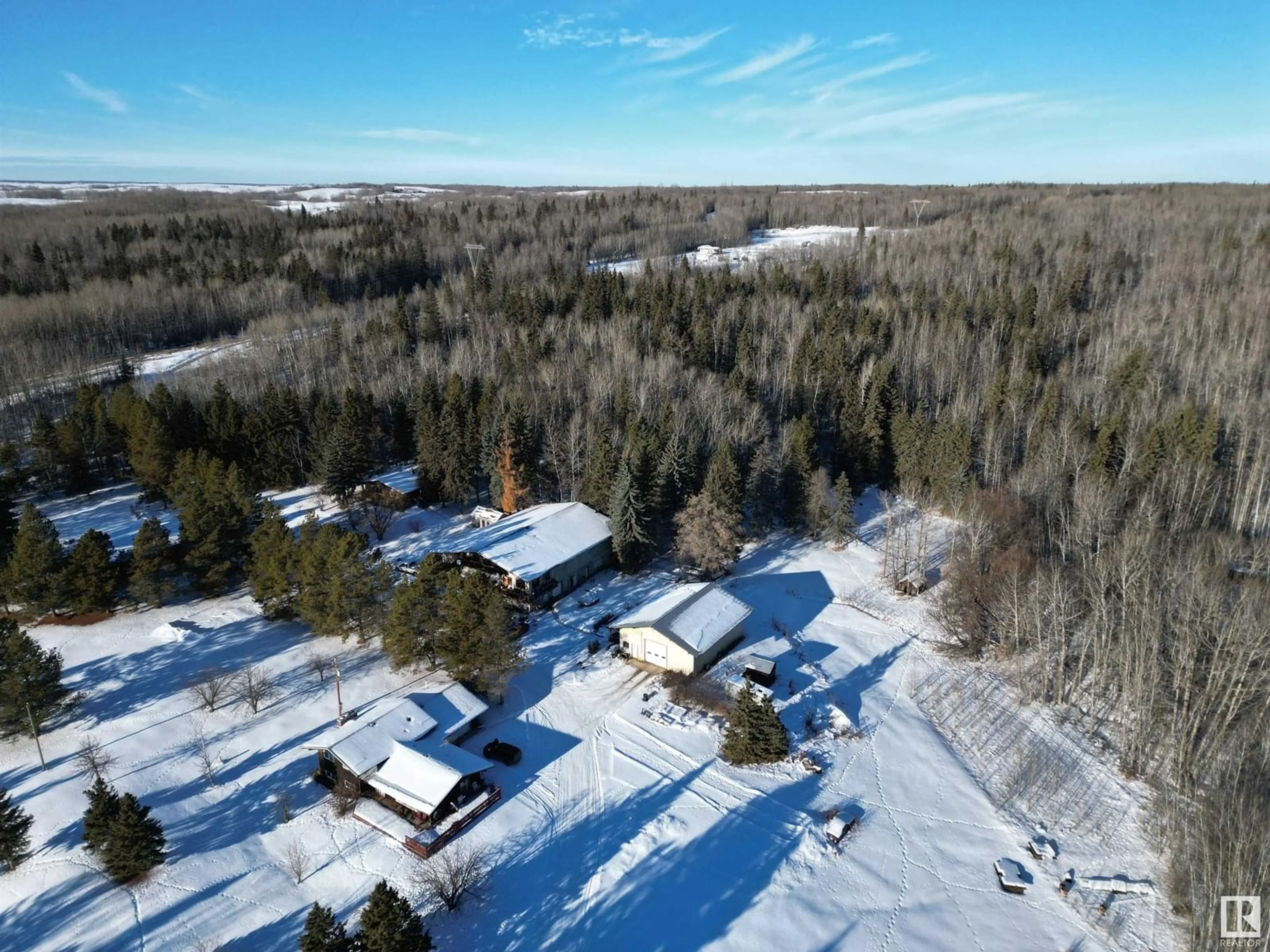 A pic from outside/outdoor area/front of a property/back of a property/a pic from drone, forest/trees view for 4012 HGHWAY 16, Rural Parkland County Alberta T0E2K0