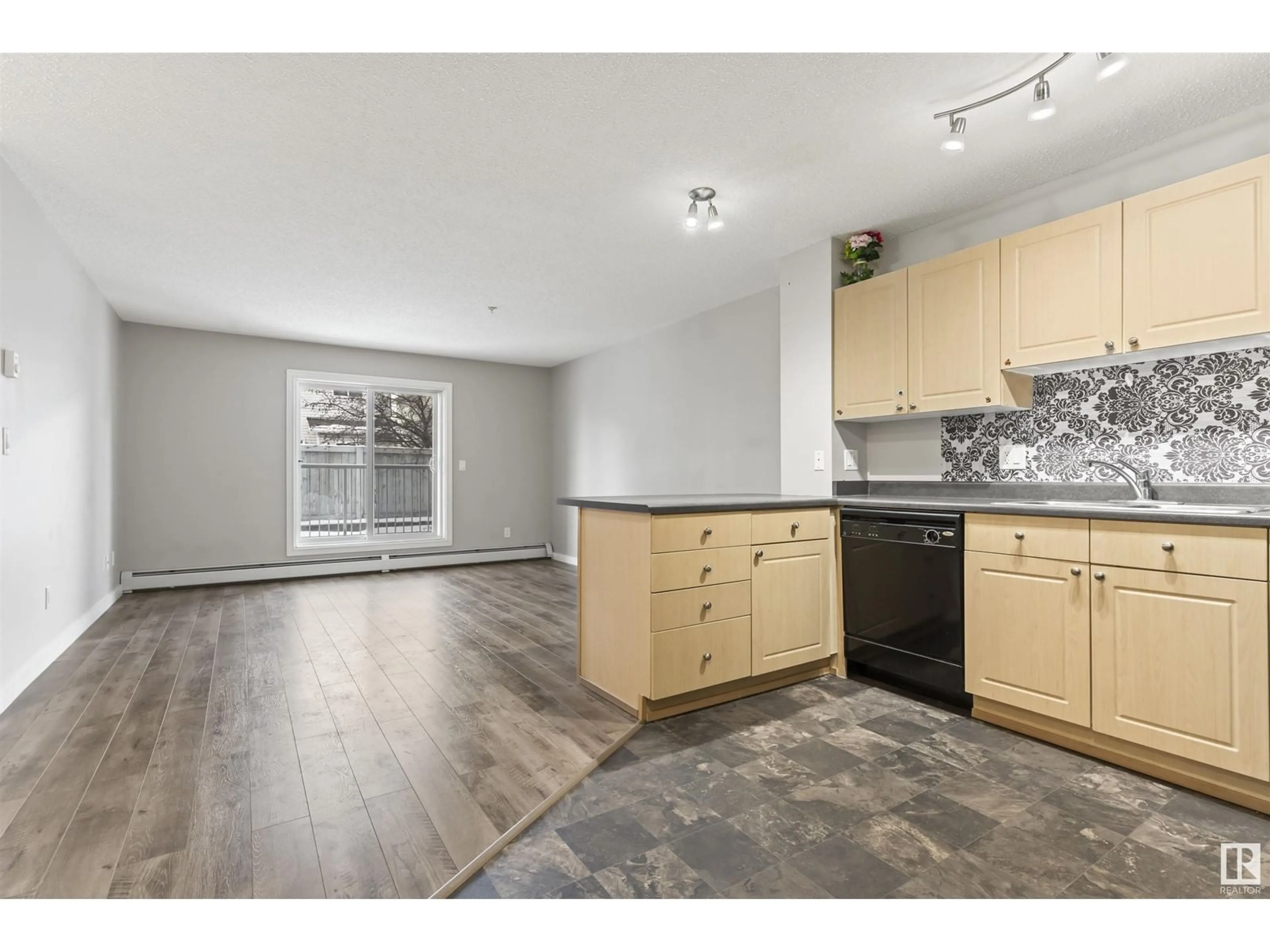 Open concept kitchen, unknown for #109 4407 23 ST NW, Edmonton Alberta T6T0B6