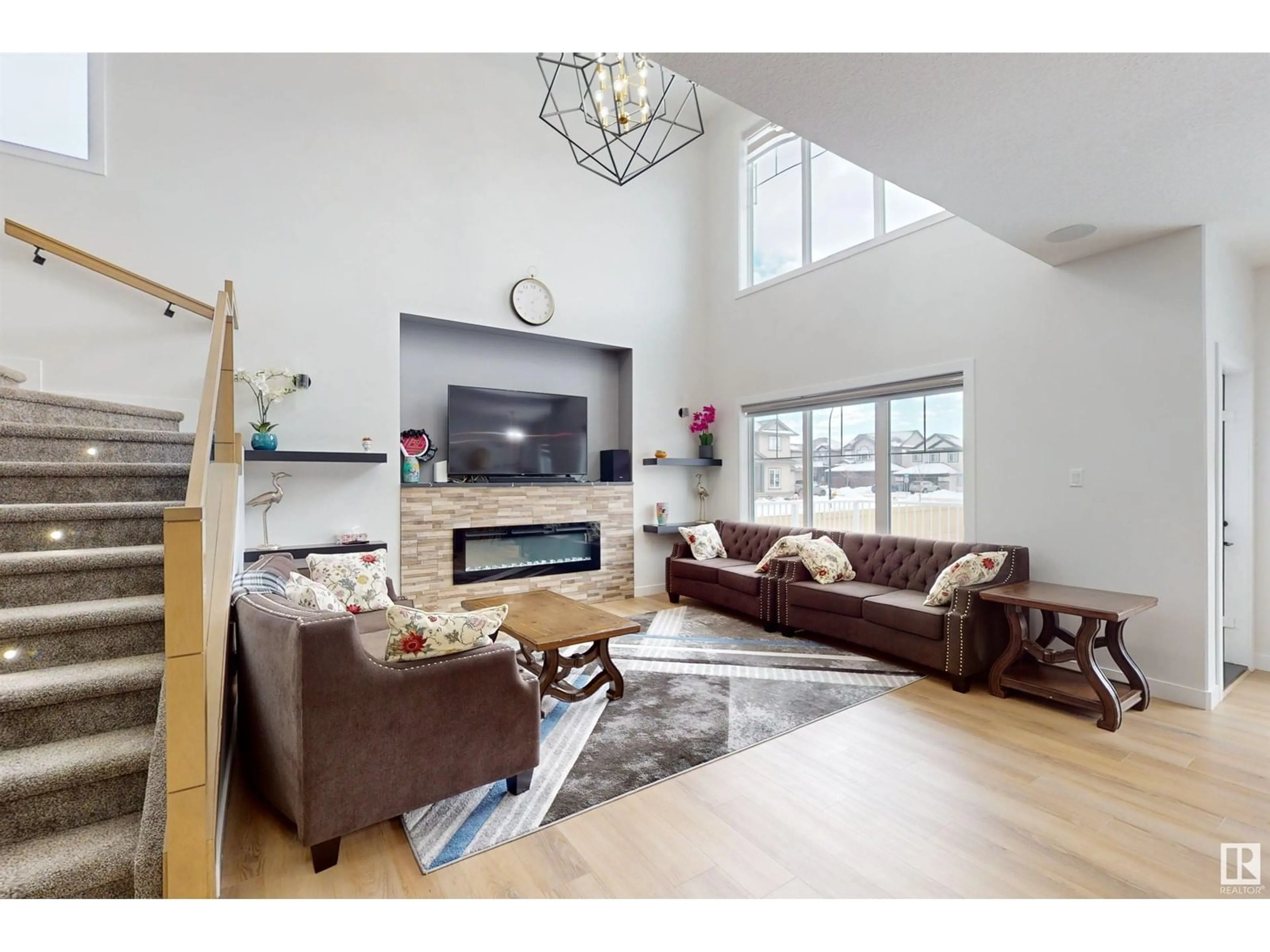 Living room with furniture, wood/laminate floor for 6601 38 AVE, Beaumont Alberta T4X2C5