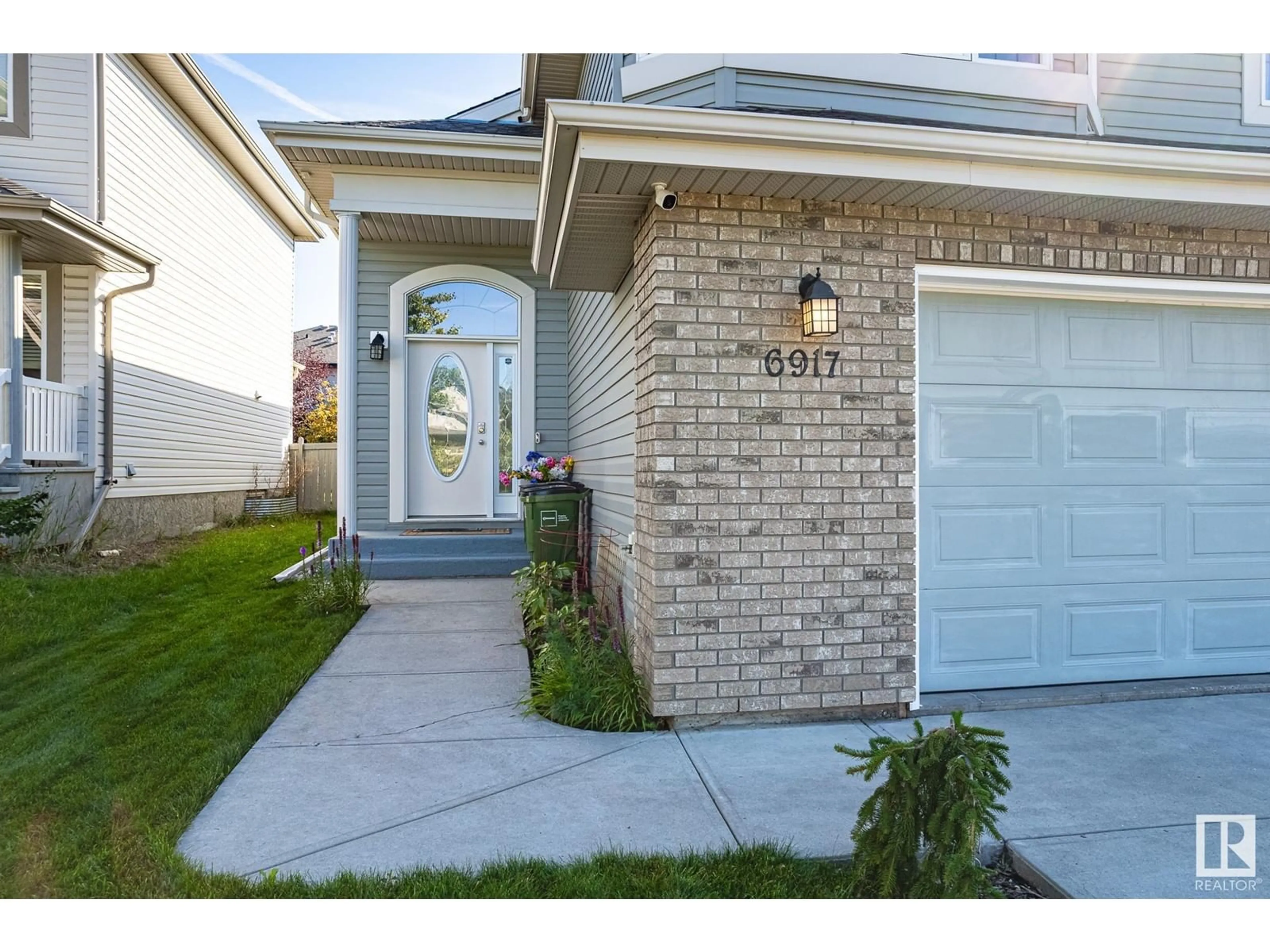 Home with brick exterior material, street for 6917 STROM LN NW, Edmonton Alberta T6R0G3