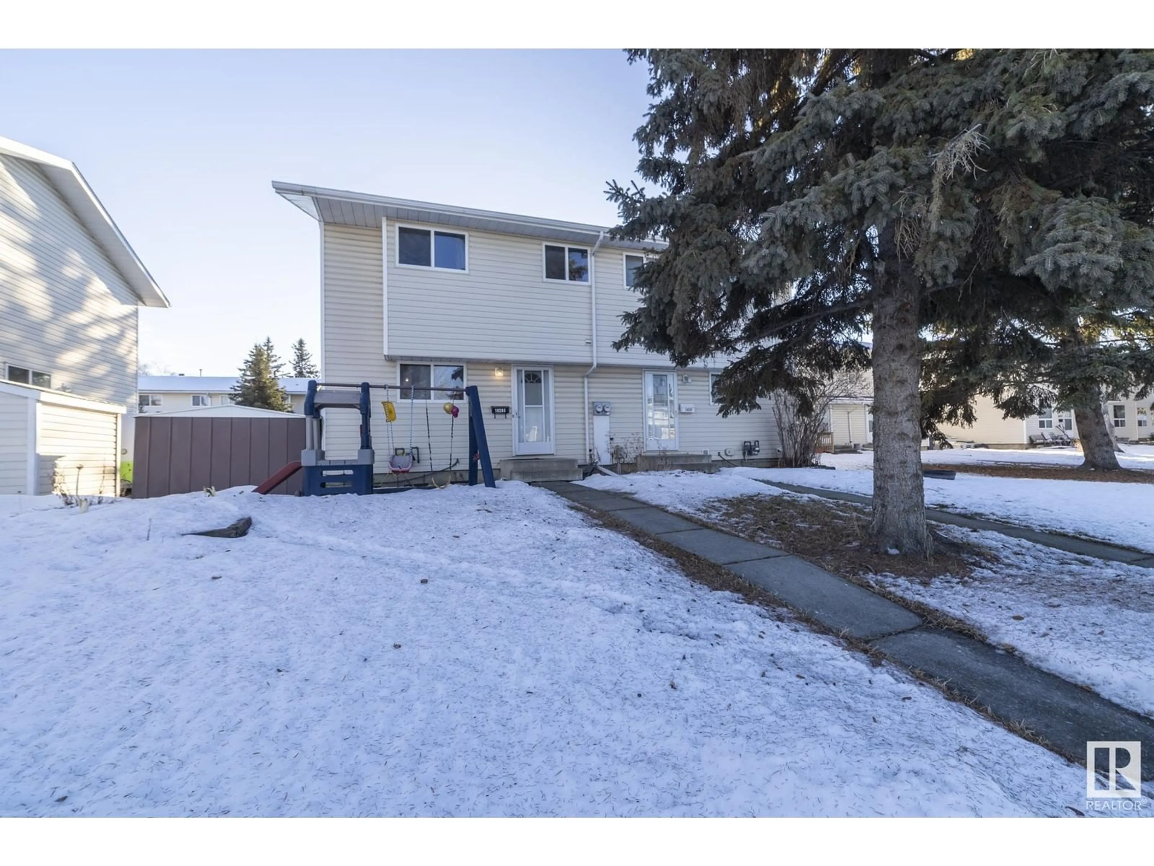 A pic from outside/outdoor area/front of a property/back of a property/a pic from drone, street for 18285 74 AV NW, Edmonton Alberta T5T2G6