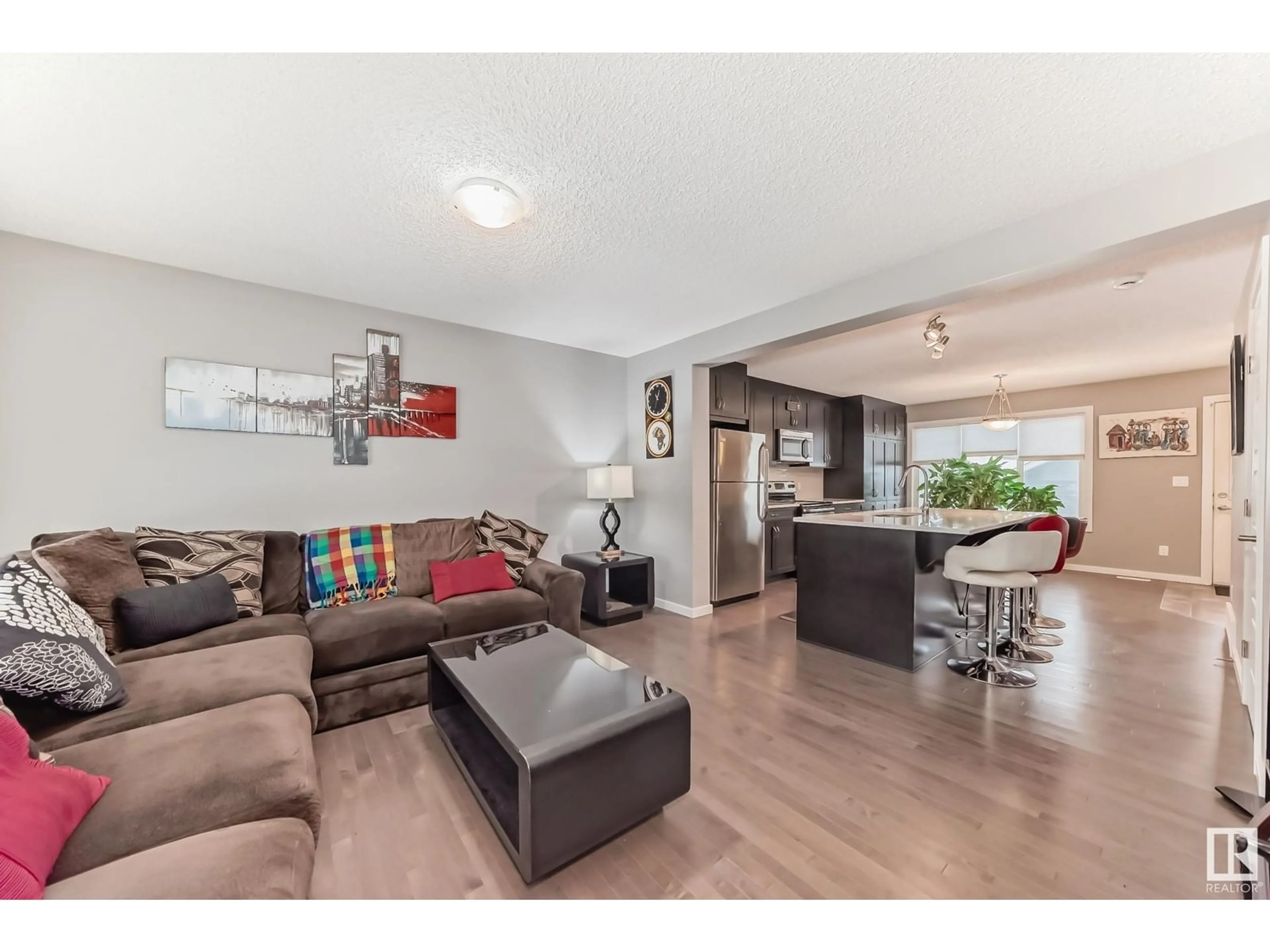 Living room with furniture, wood/laminate floor for 5526 CRABAPPLE LO SW SW, Edmonton Alberta T6X1S5