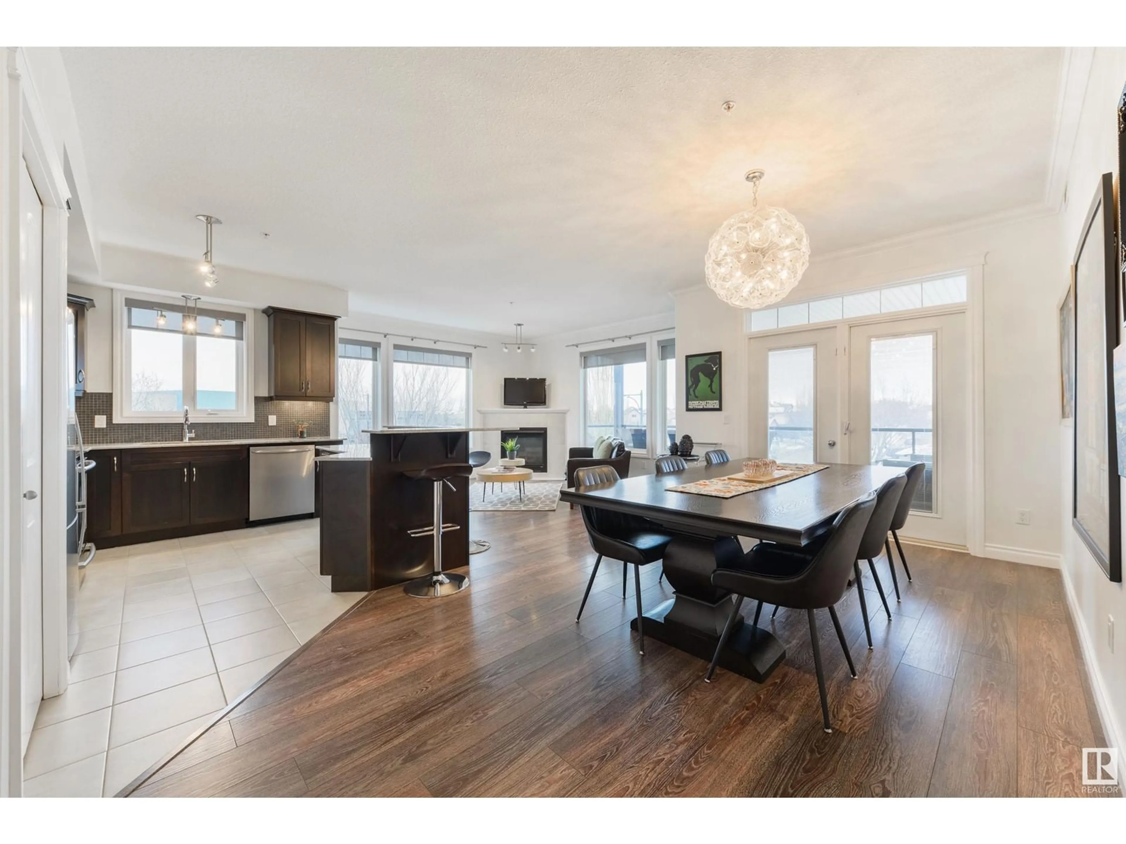 Open concept kitchen, wood/laminate floor for #309 12408 15 AV SW SW, Edmonton Alberta T6W1X2