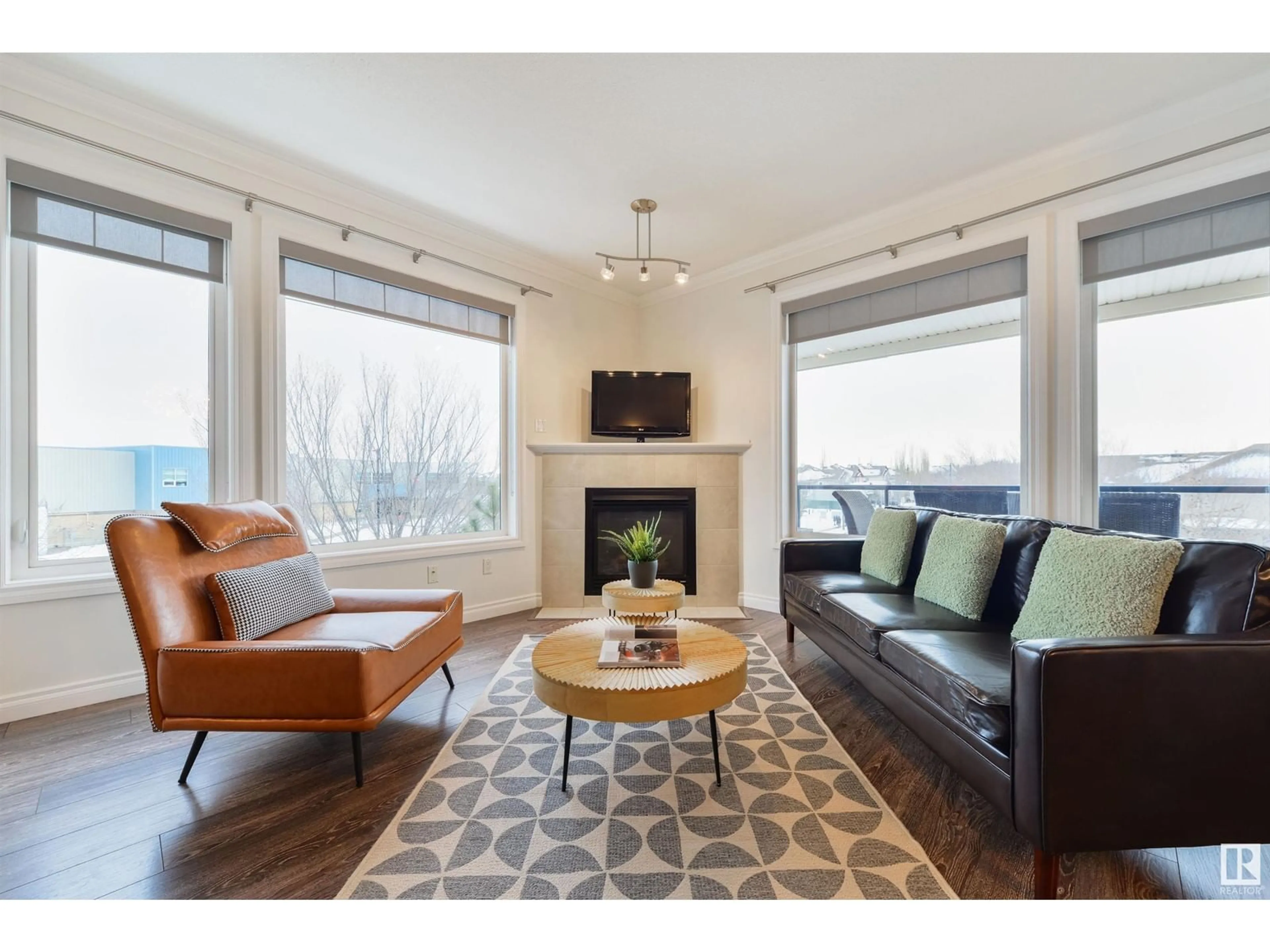 Living room with furniture, wood/laminate floor for #309 12408 15 AV SW SW, Edmonton Alberta T6W1X2