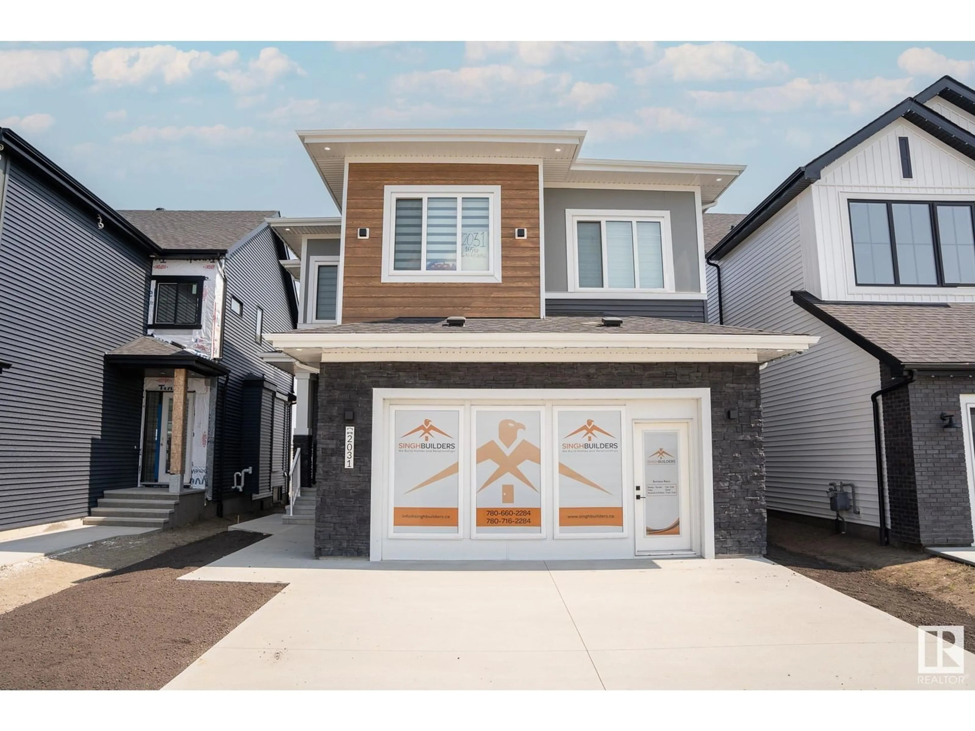 Home with vinyl exterior material, street for 2031 165 Street SW, Edmonton Alberta T6W5K1