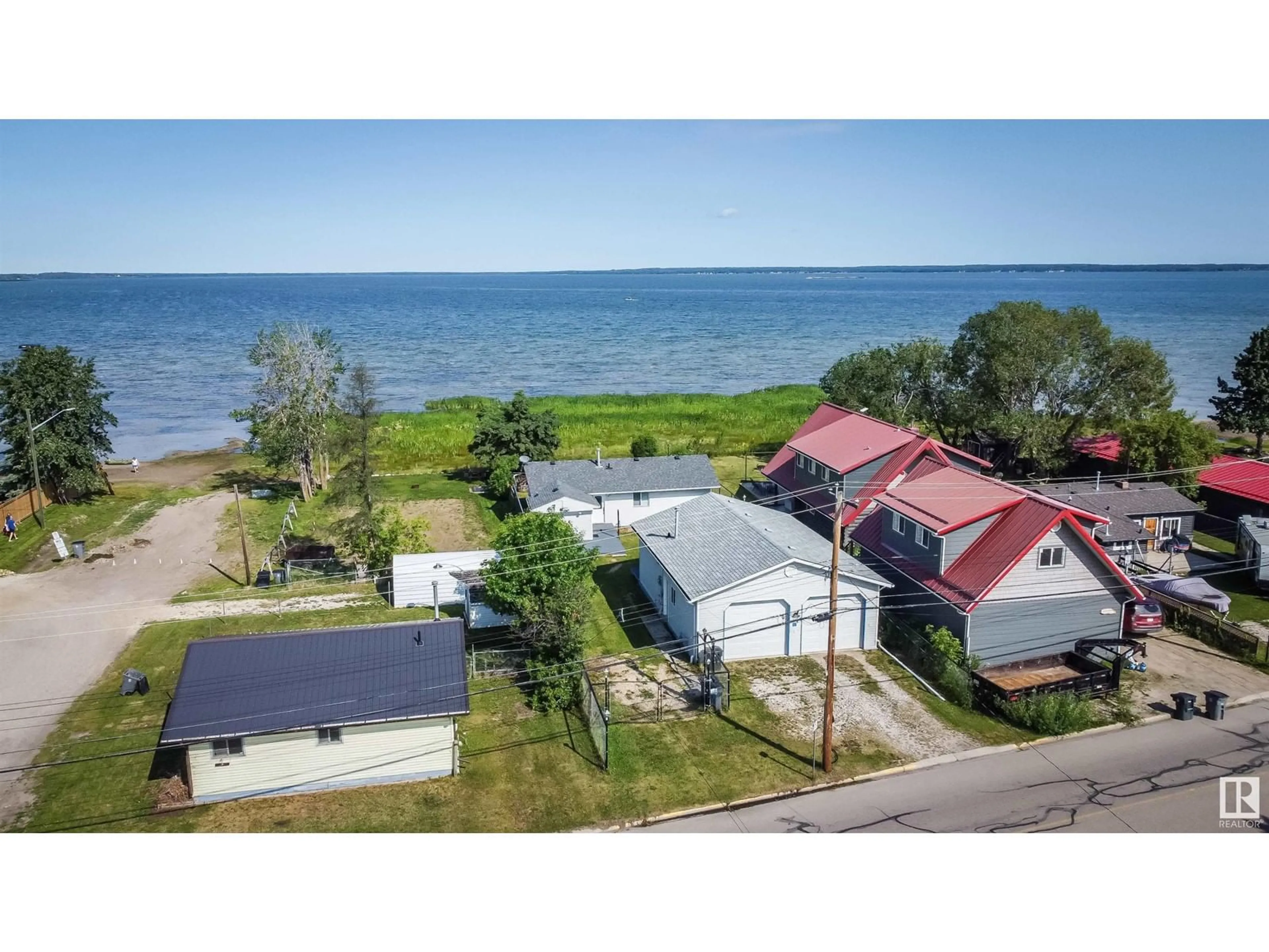 A pic from outside/outdoor area/front of a property/back of a property/a pic from drone, water/lake/river/ocean view for 5036 50 AV, Rural Lac Ste. Anne County Alberta T0E0A0